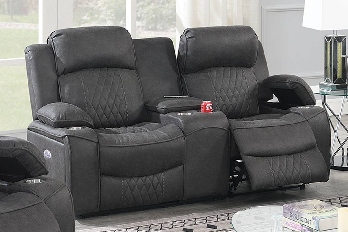 Charcoal gray reclining sofa with diamond tufting and builtin cup holders for ultimate comfort