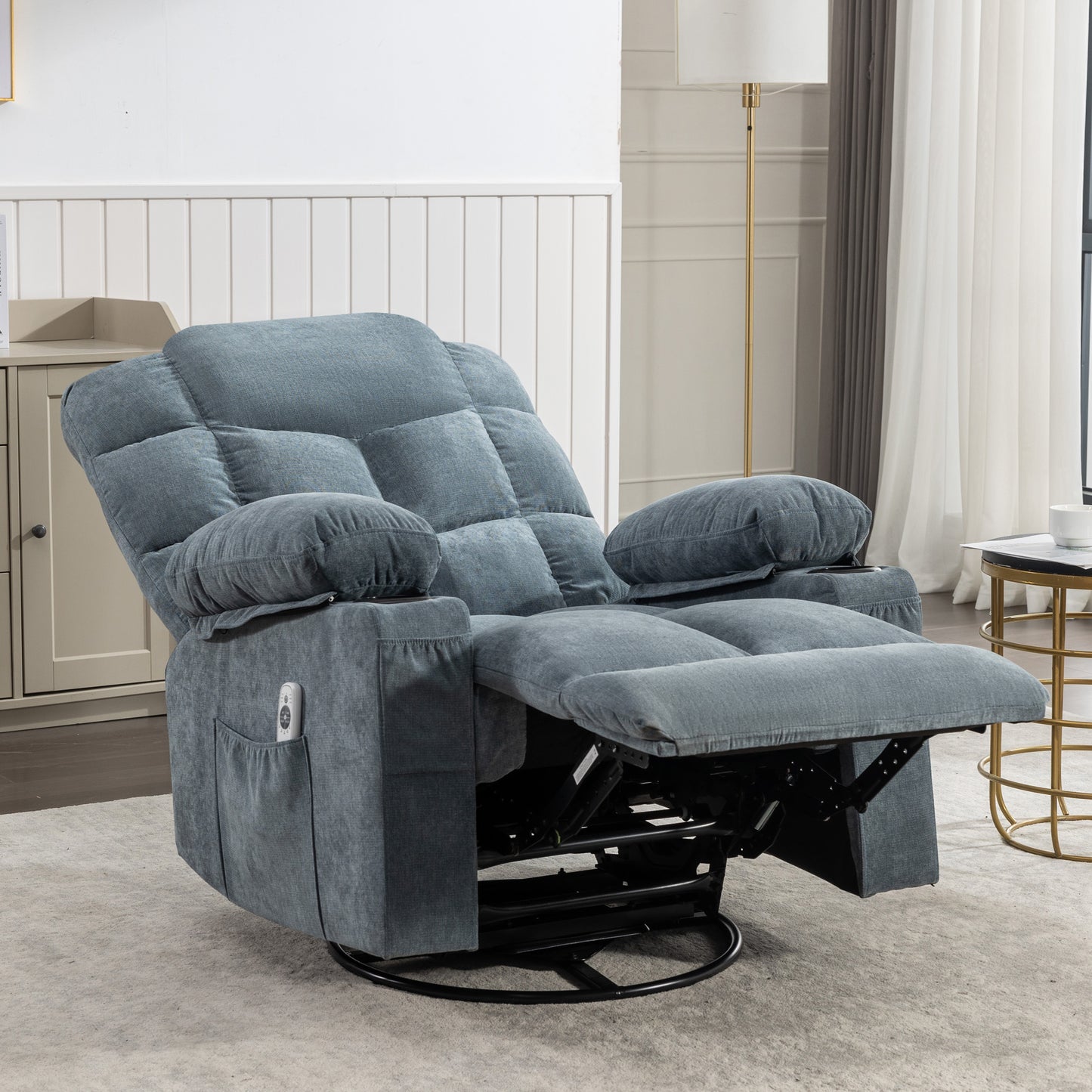 Plush blue fabric recliner chair with footrest extended featuring cup holders and side pocket