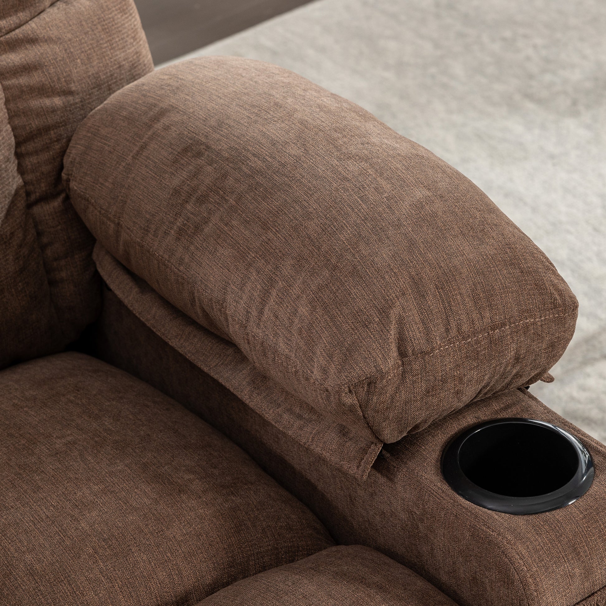 Brown fabric recliner armrest with integrated cup holder perfect for home theater seating