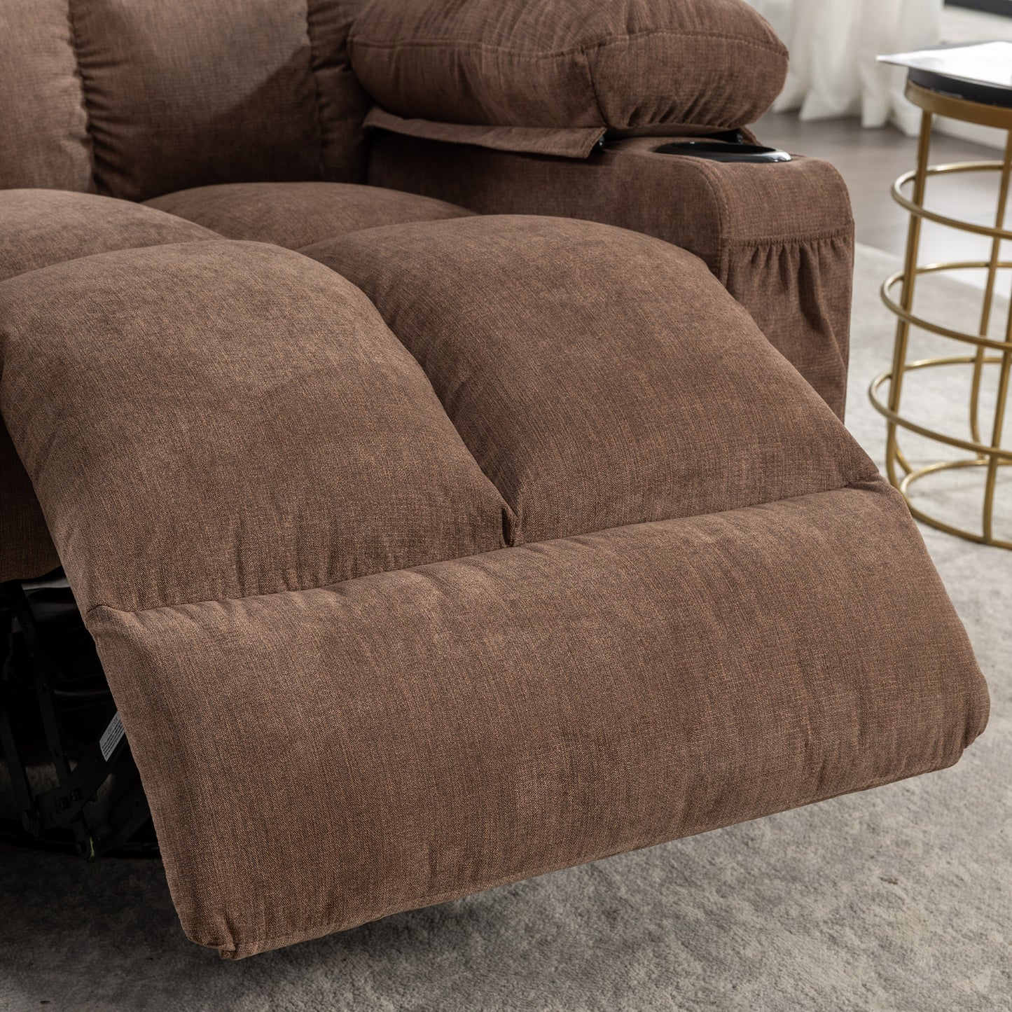 Brown fabric recliner with extended footrest and cupholder