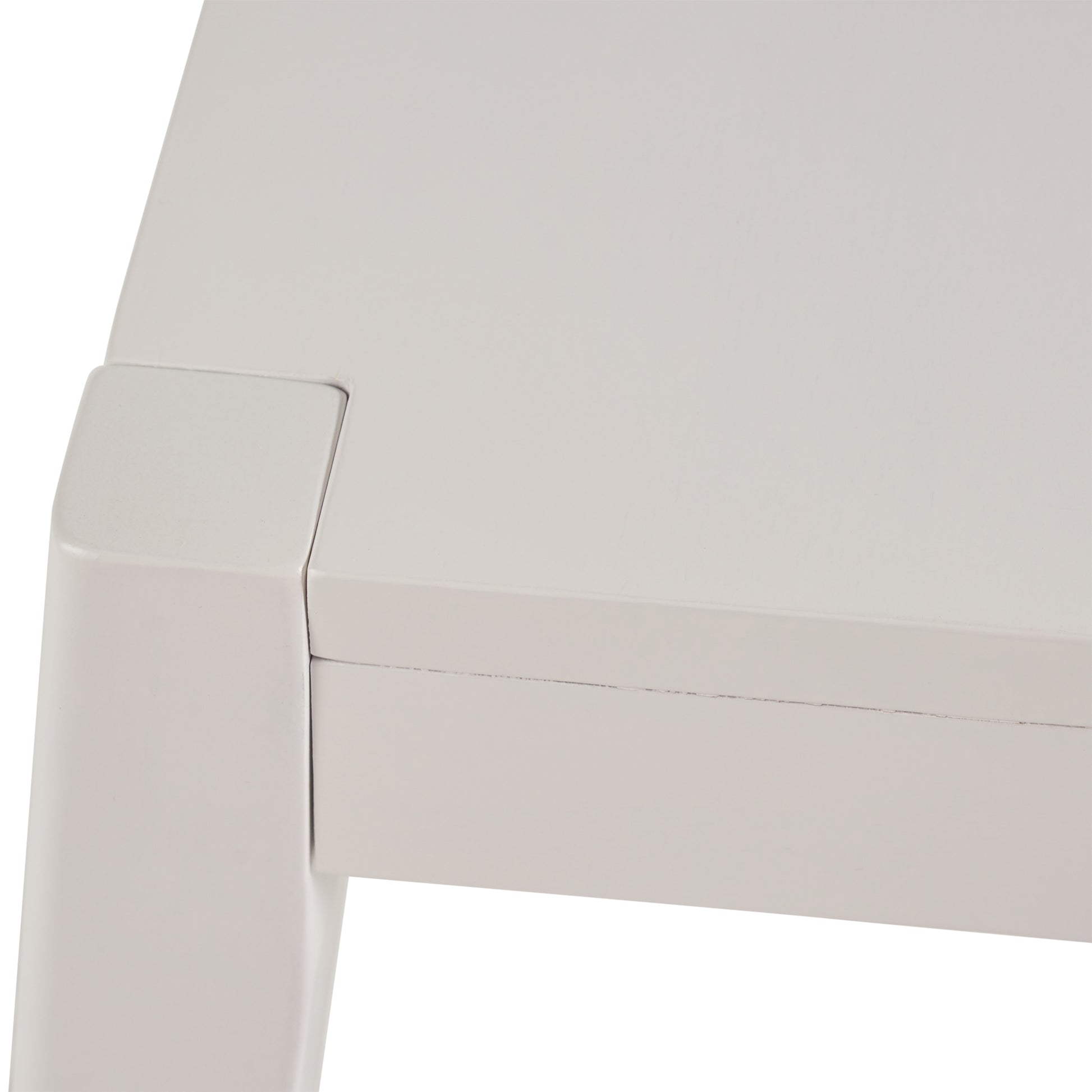 Light gray contemporary coffee table corner detail with clean lines