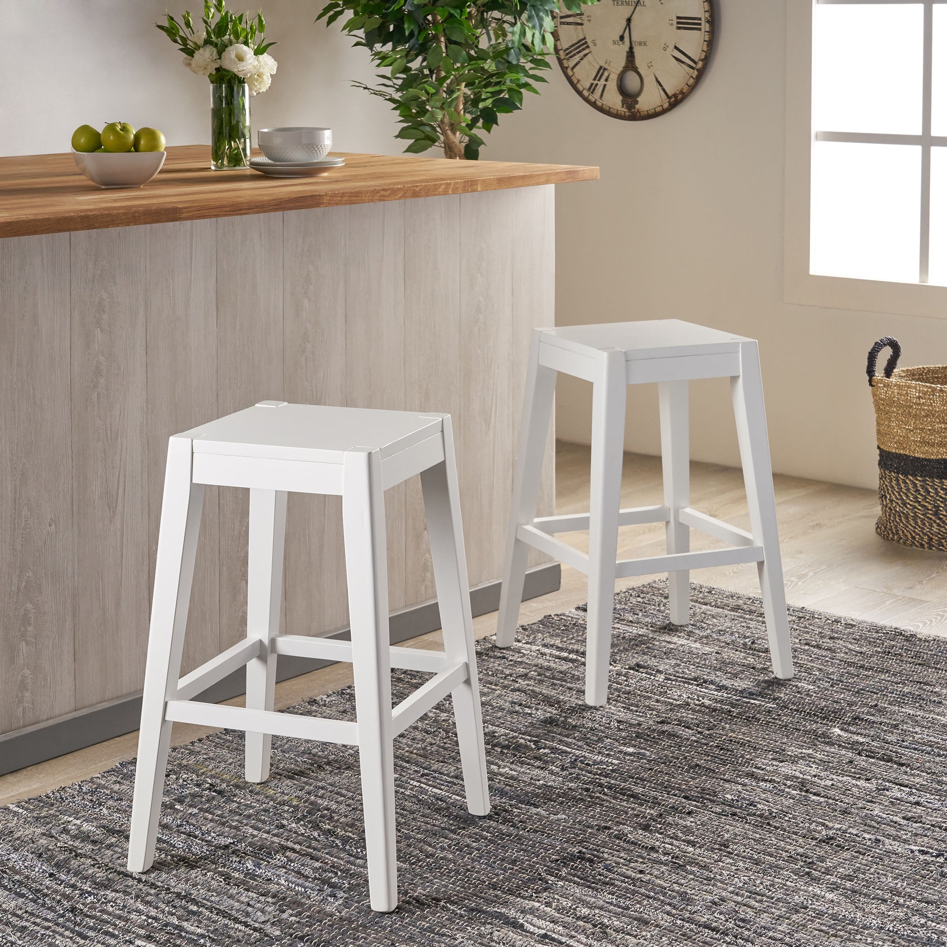 Two white modern counter stools with wooden legs and seats ideal for kitchen islands