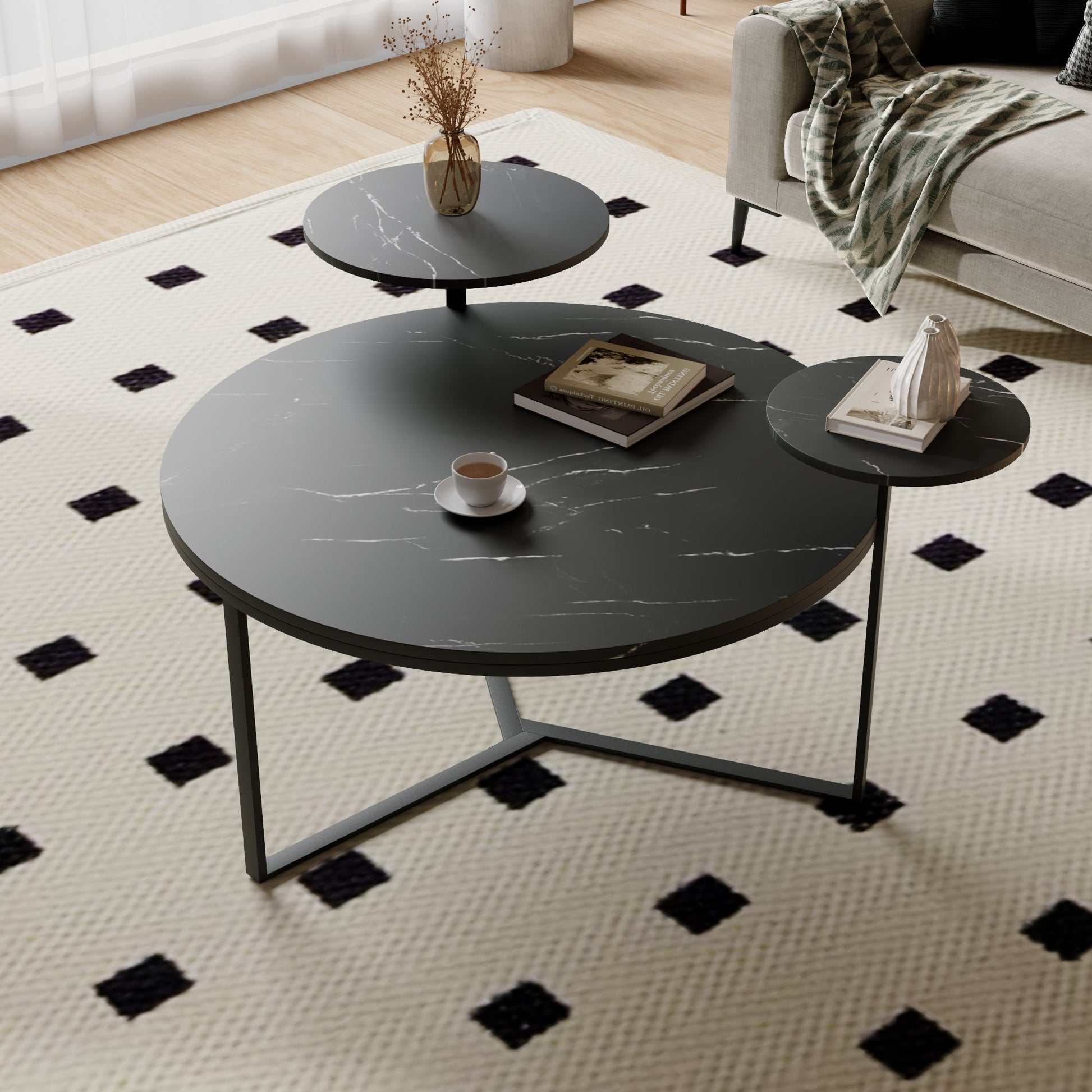 Nesting coffee table with faux marble black tops and dark metal frame