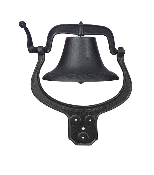 Black cast iron wallmounted bell with ornate detailing and a manual ring lever for a rustic touch