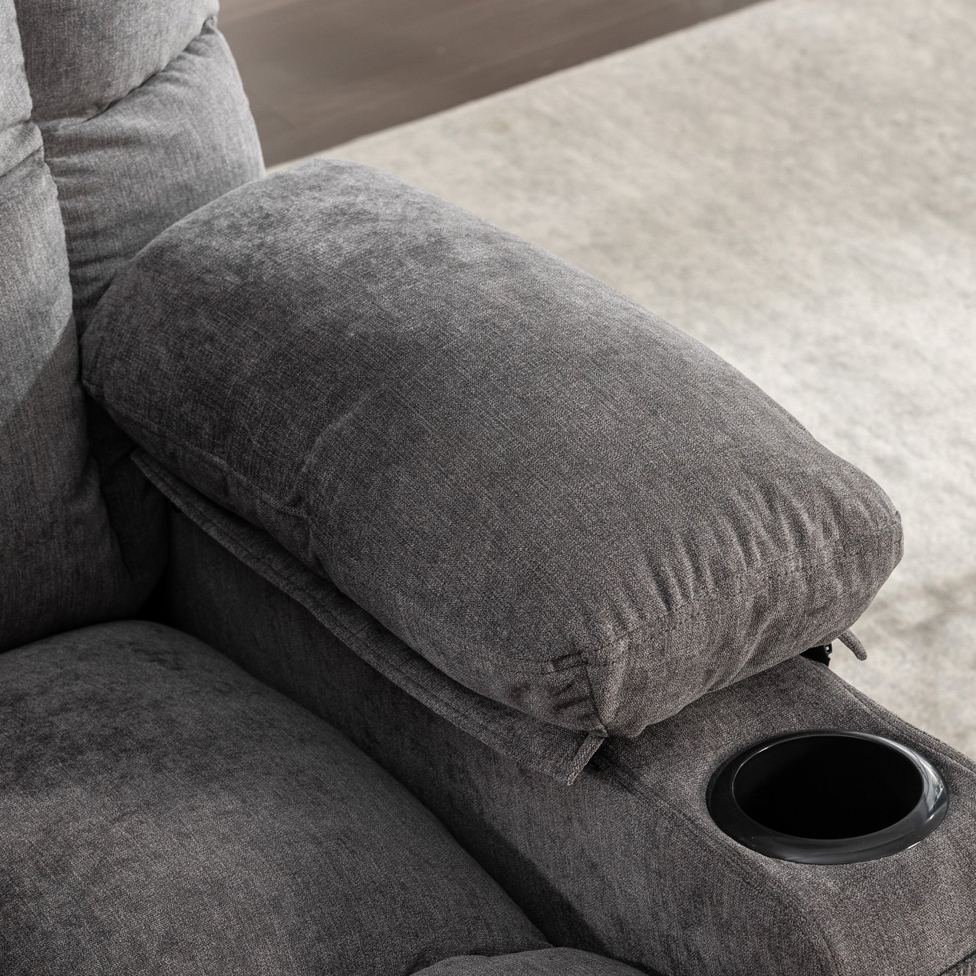Gray fabric recliner armrest with builtin black cup holder for ultimate relaxation