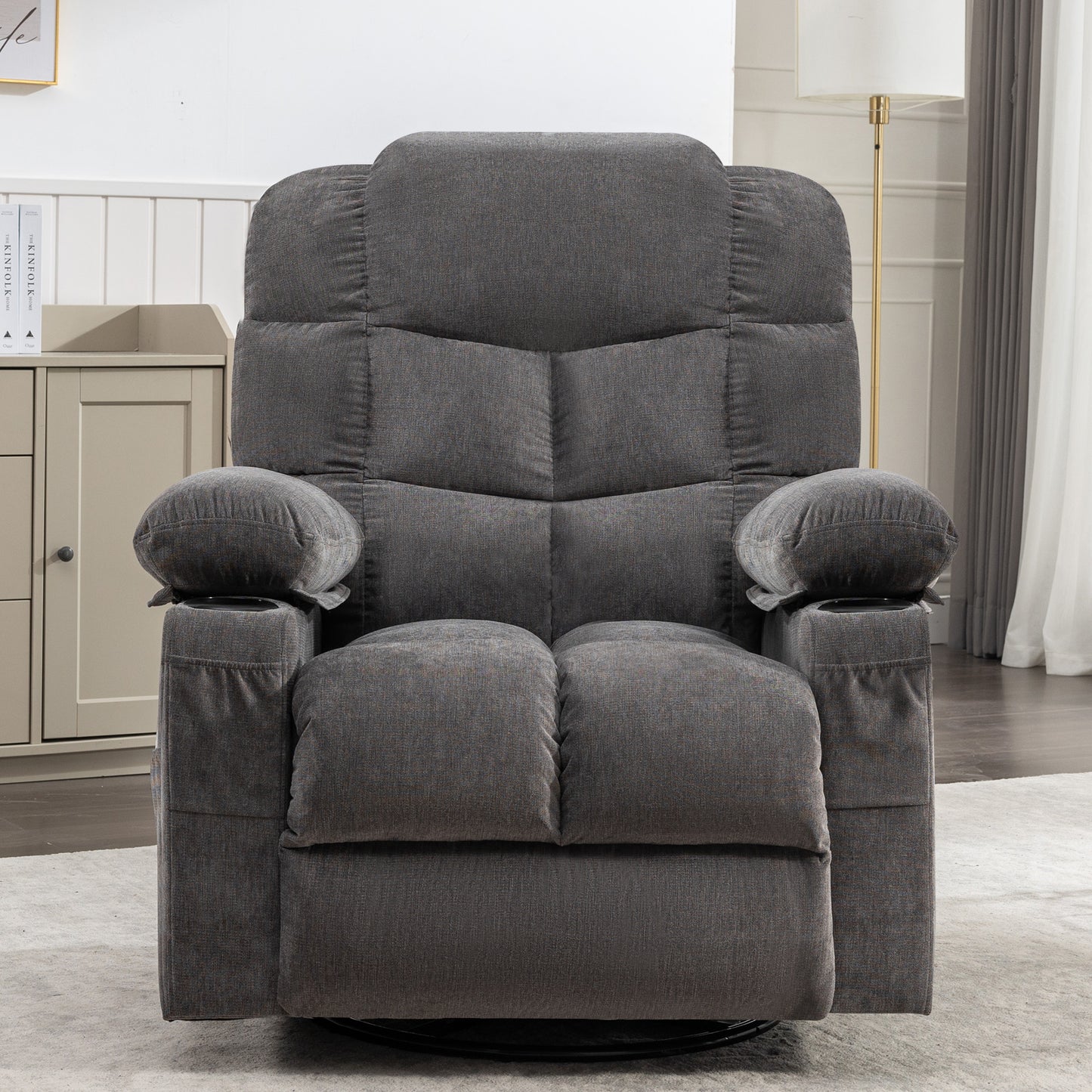 Padded charcoal gray fabric recliner chair with plush cushions and dual cup holders