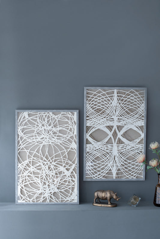 Abstract white string art on linen canvas in a grey distressed frame