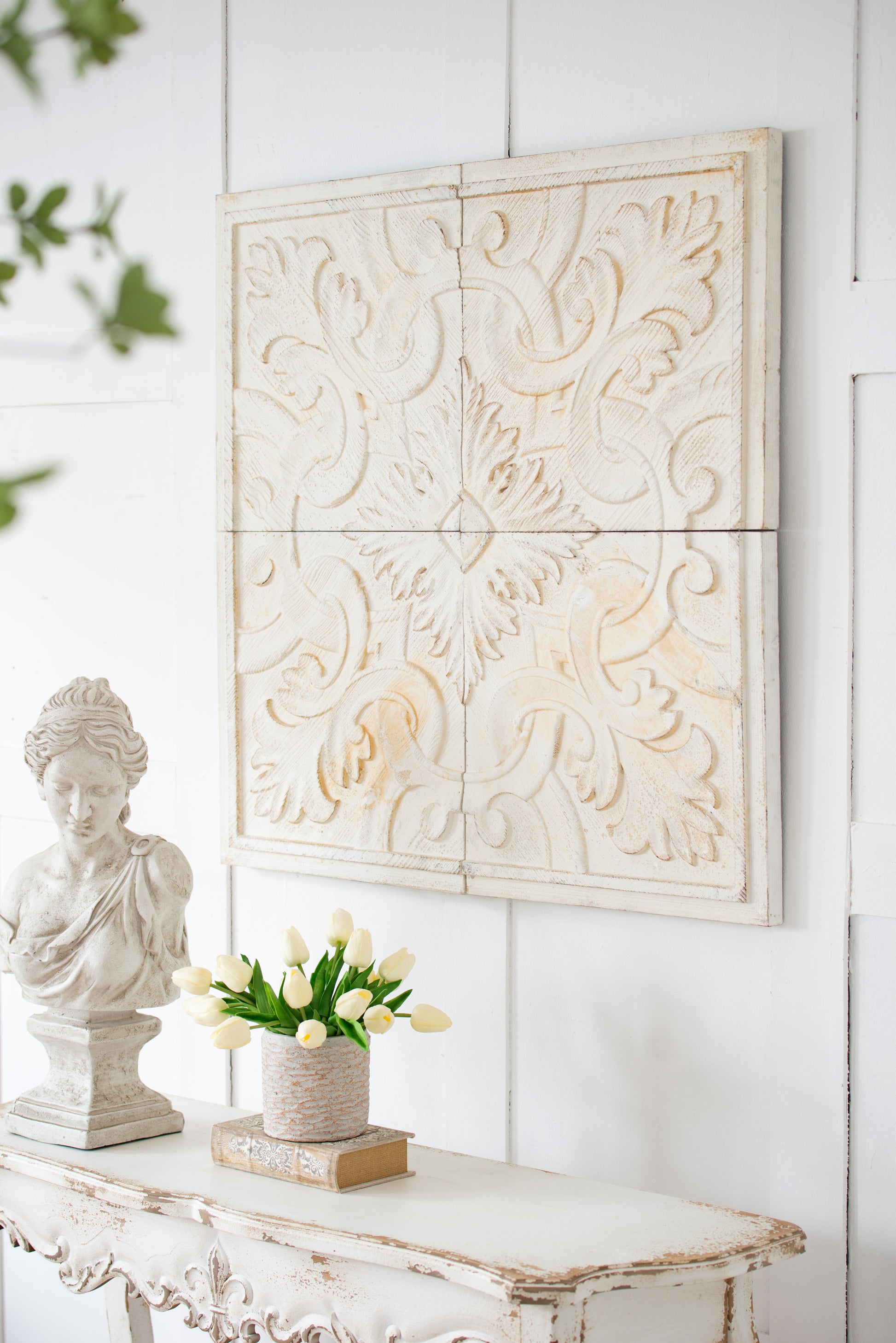 Cream distressed wood wall art with intricate floral carvings