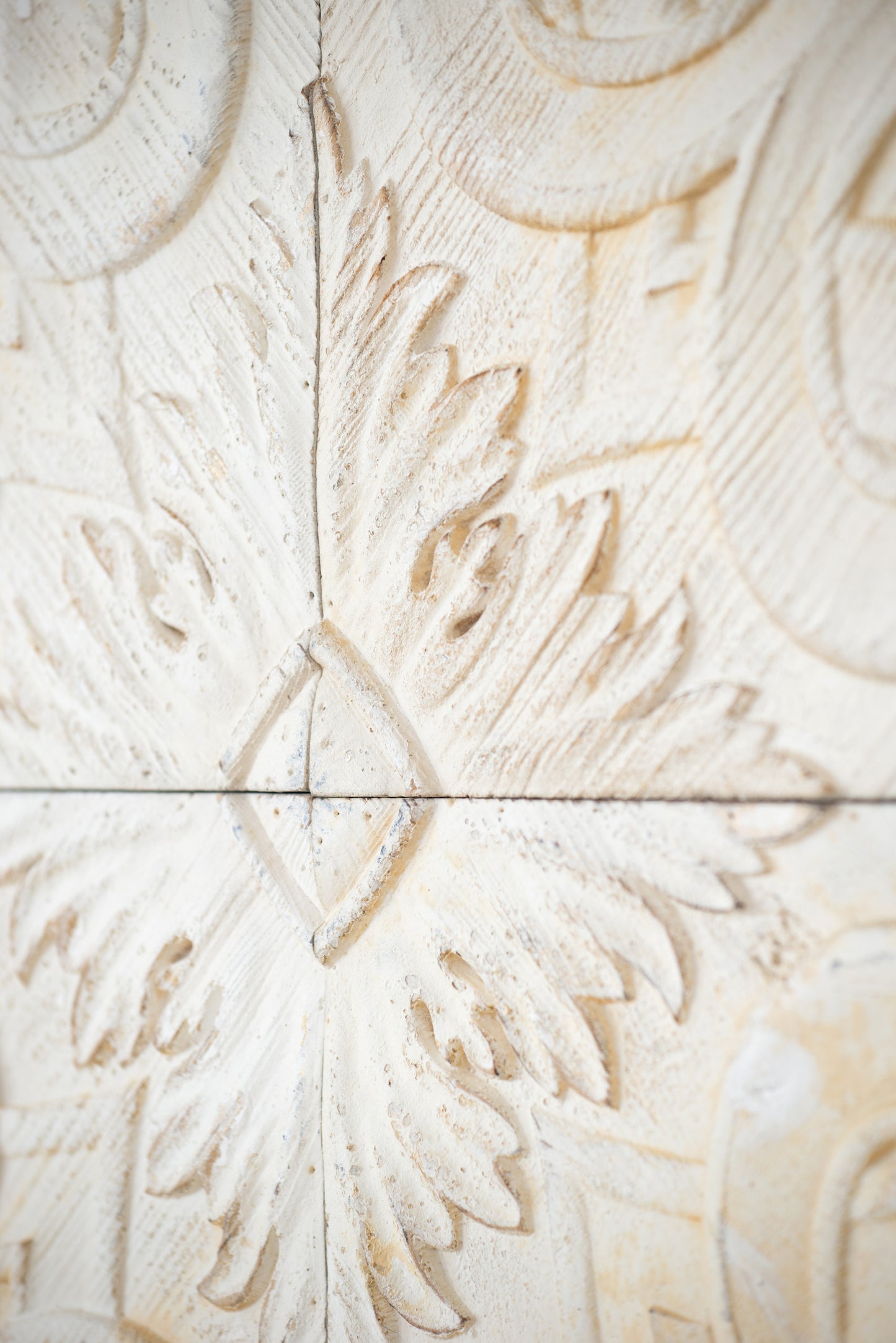 Antique white carved wood panel with ornate floral leaf design