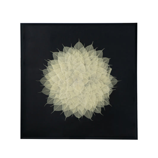 Framed artwork of layered delicate white skeleton leaves forming a mandala pattern on a black background