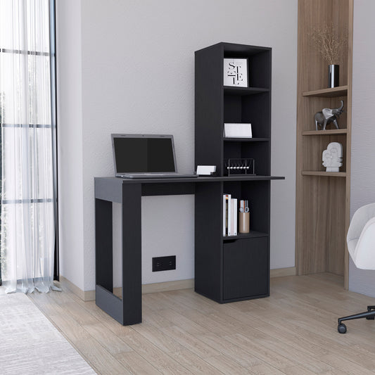 Dark grey modern desk with integrated shelving unit featuring a laptop and books