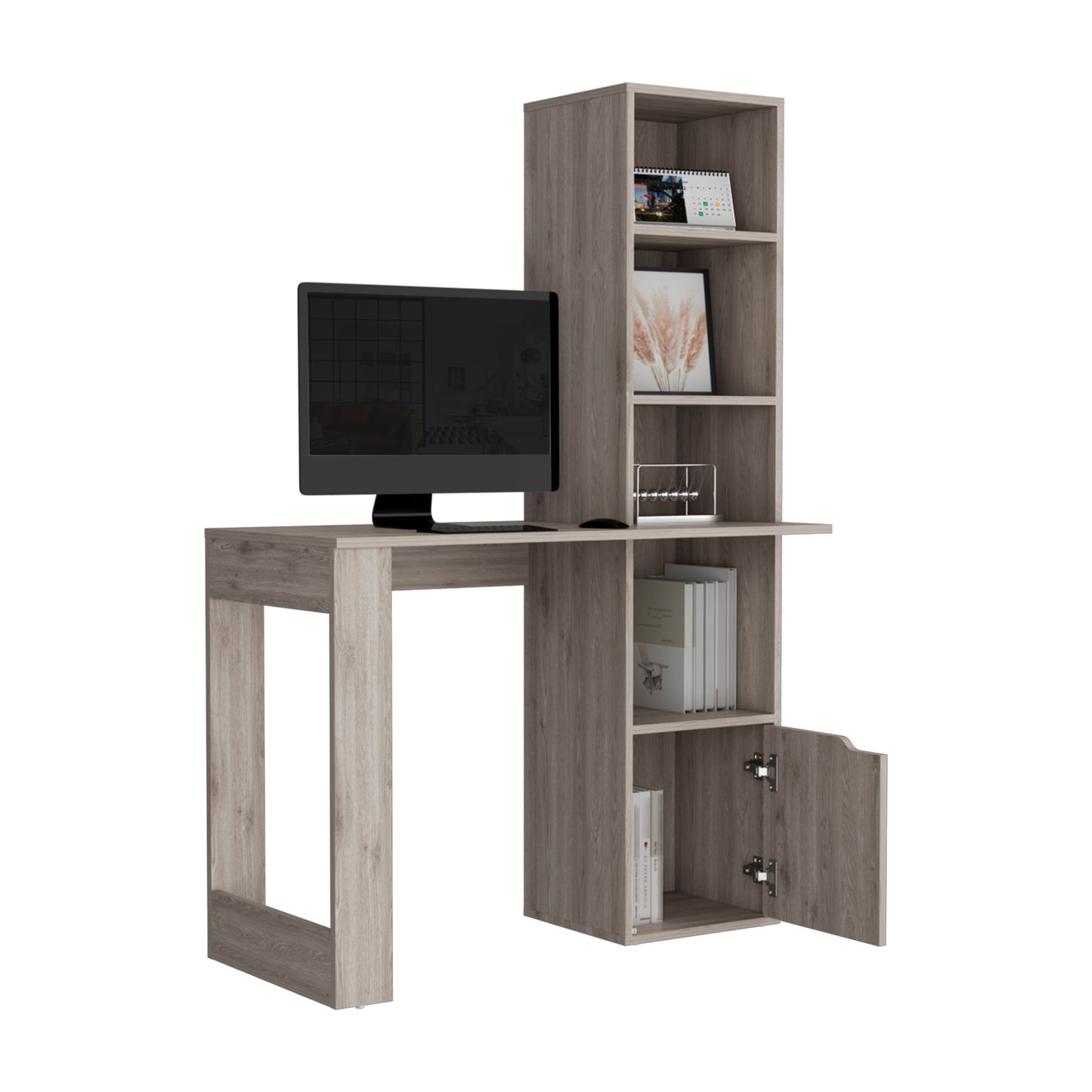 Grey wood computer desk with attached shelving unit holding books and decor