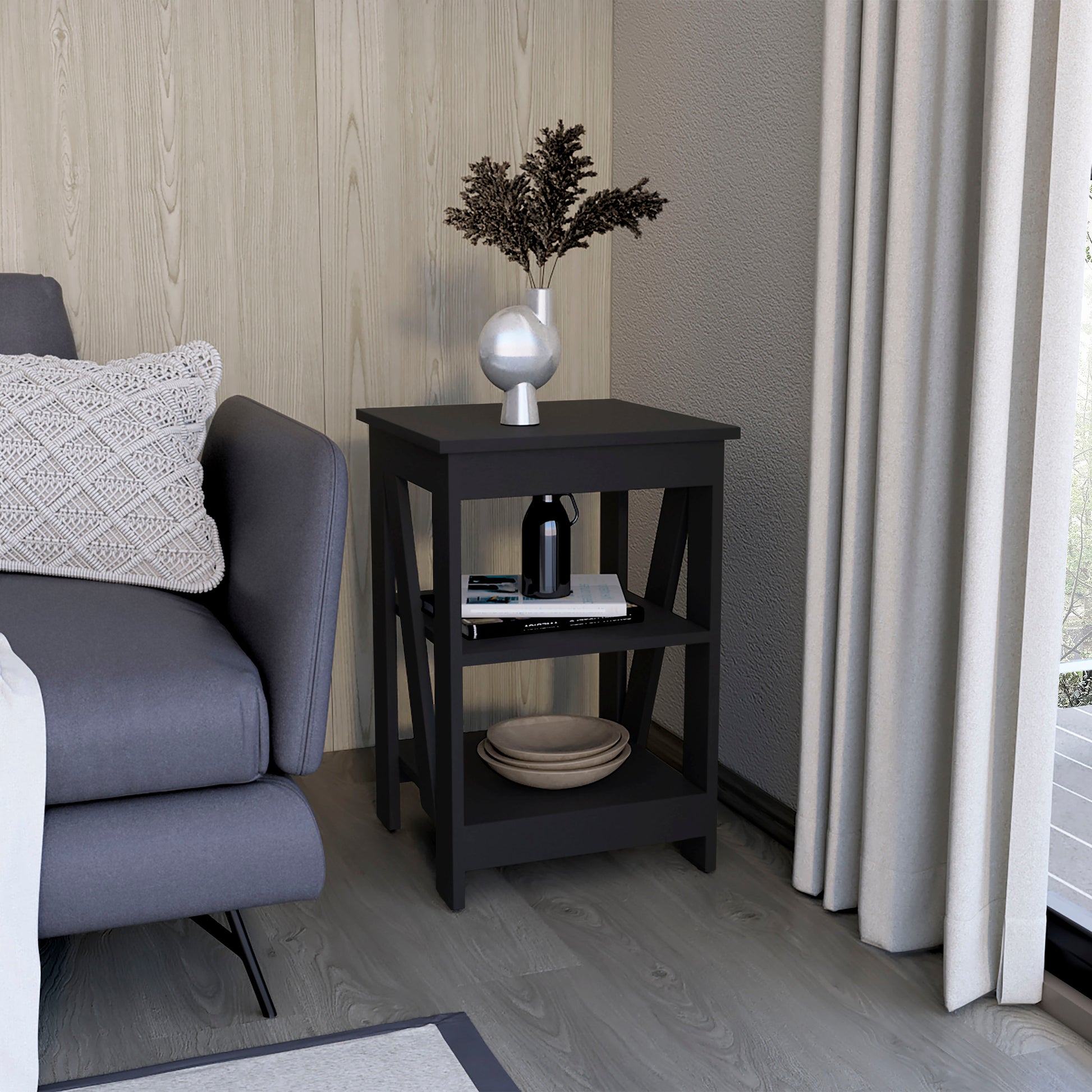 Black twotier side table with modern design featuring a decorative vase and books