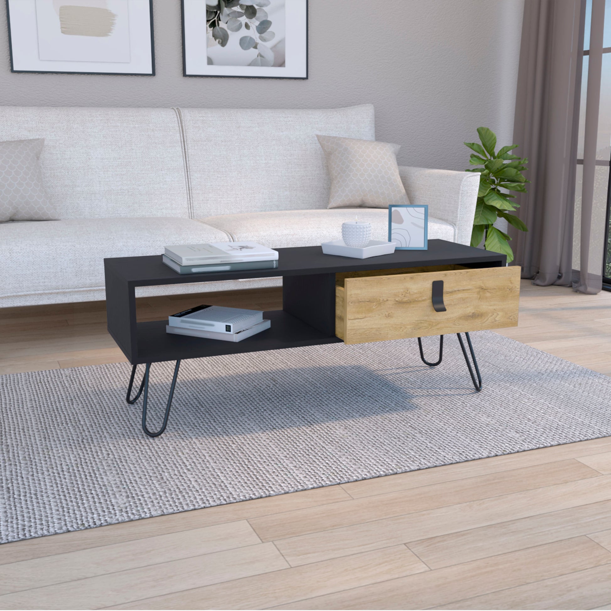 Modern black coffee table with blonde wood drawer and hairpin legs