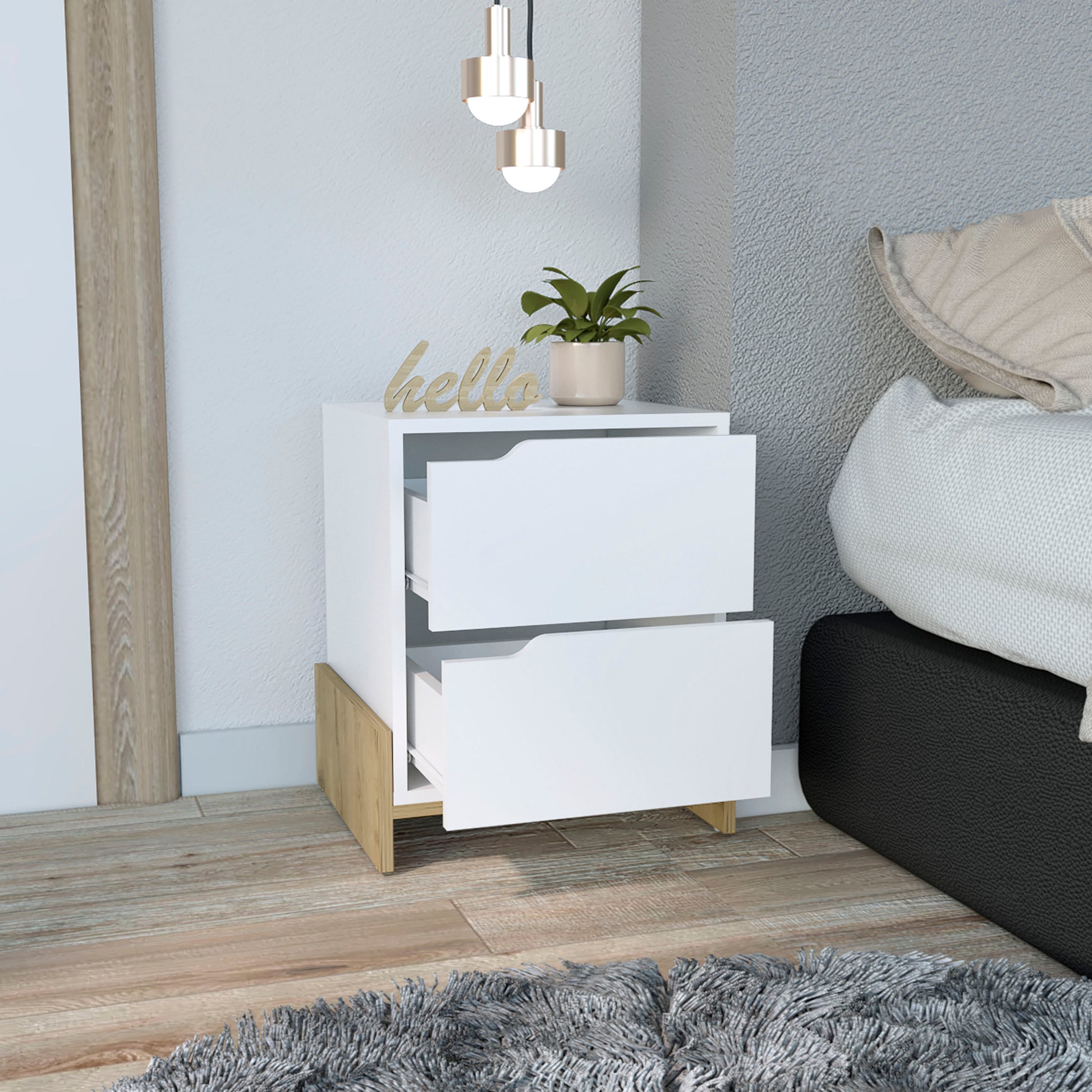 Modern white bedside table with two drawers and wooden accents complementing minimalist bedroom decor