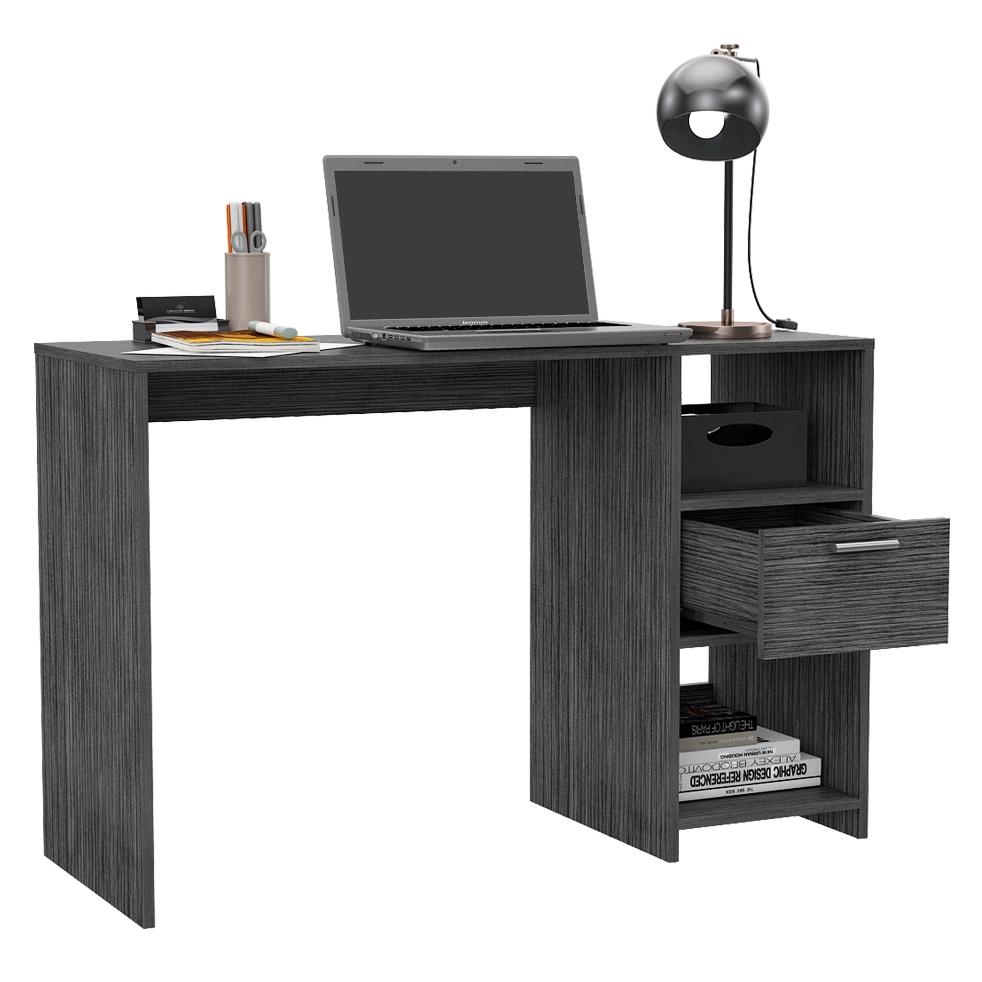 Dark gray laminate writing desk with open shelves and a drawer holding a laptop and desk lamp