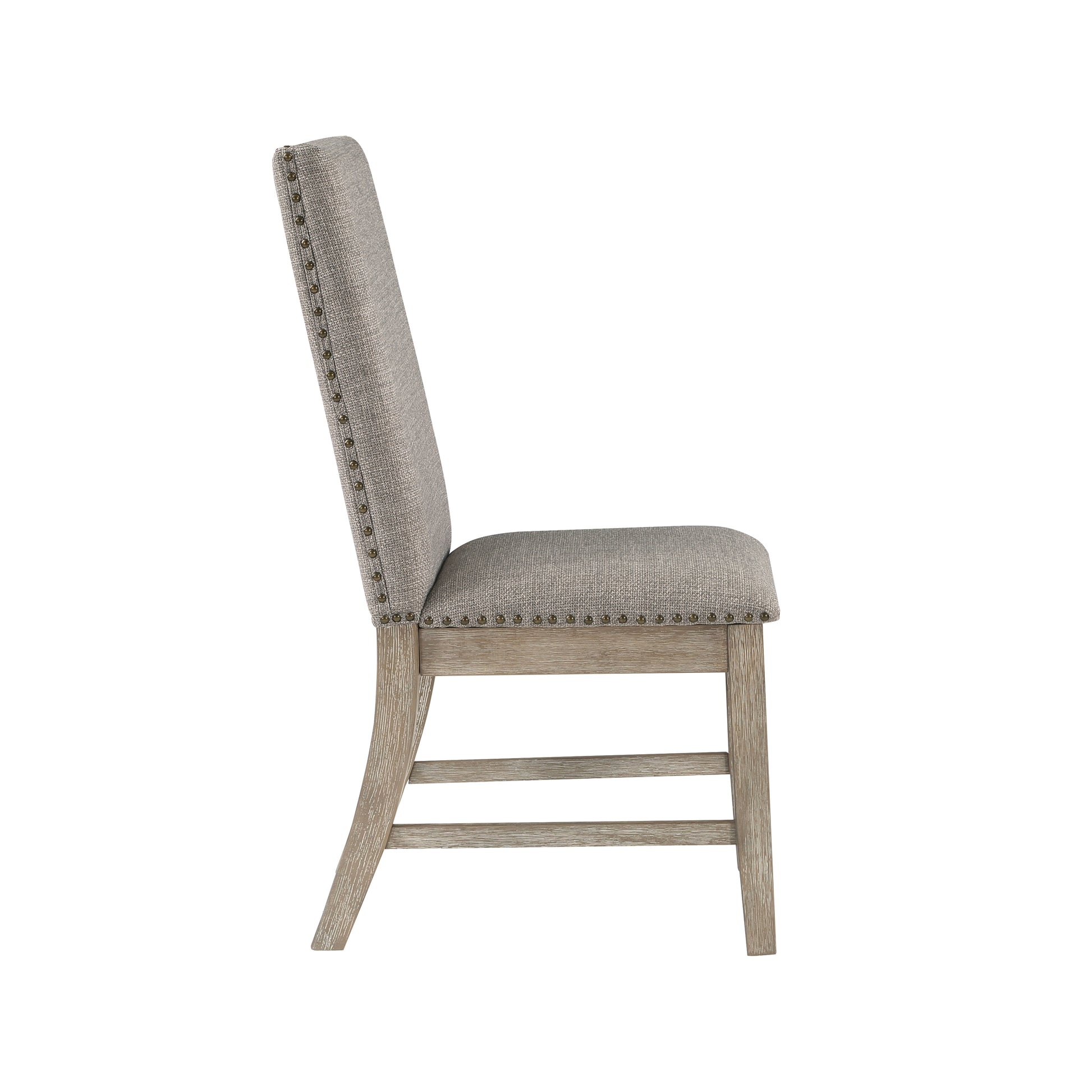 Gray upholstered dining chair with nailhead trim and weathered wood legs