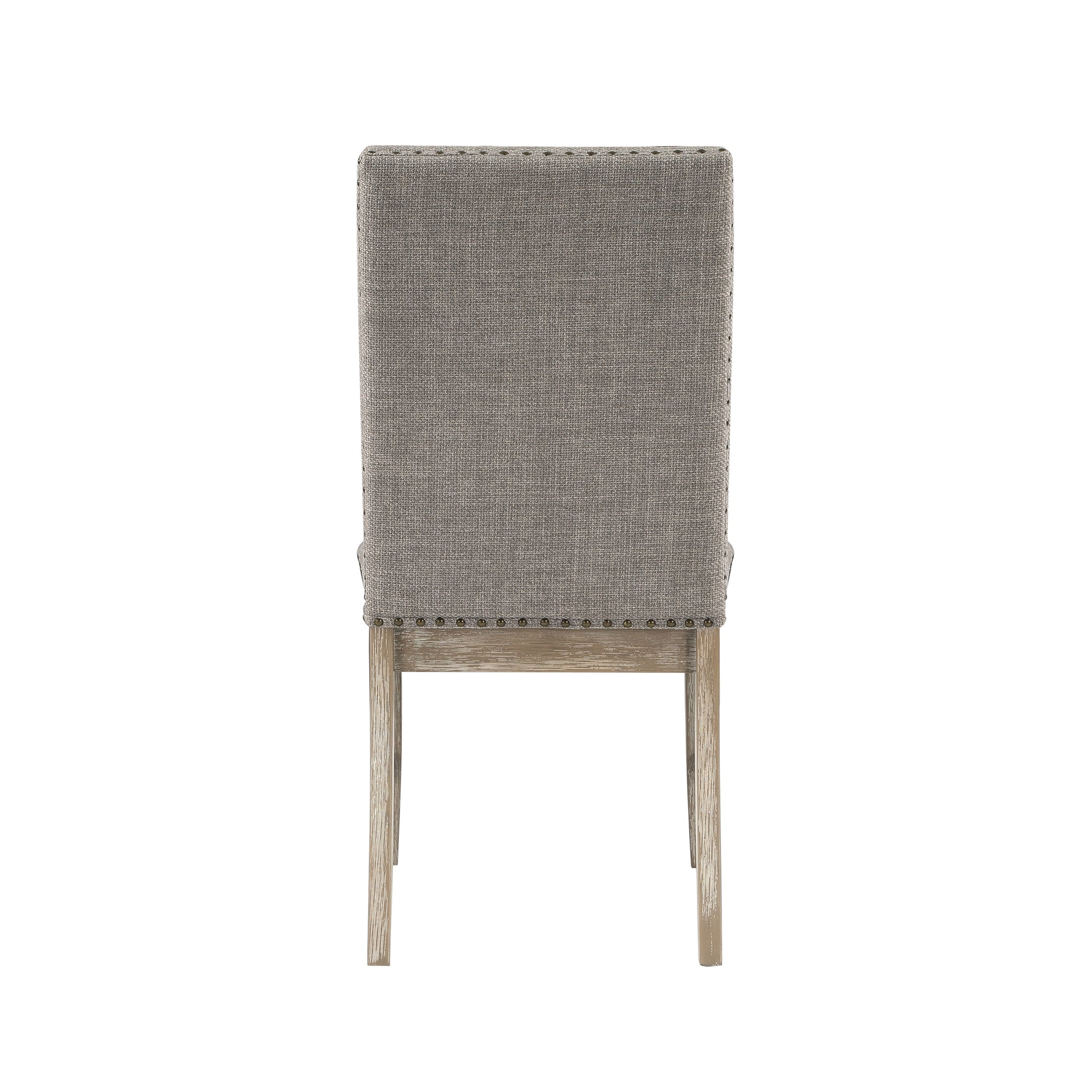 Back view of a gray upholstered dining chair with nailhead trim and wooden legs