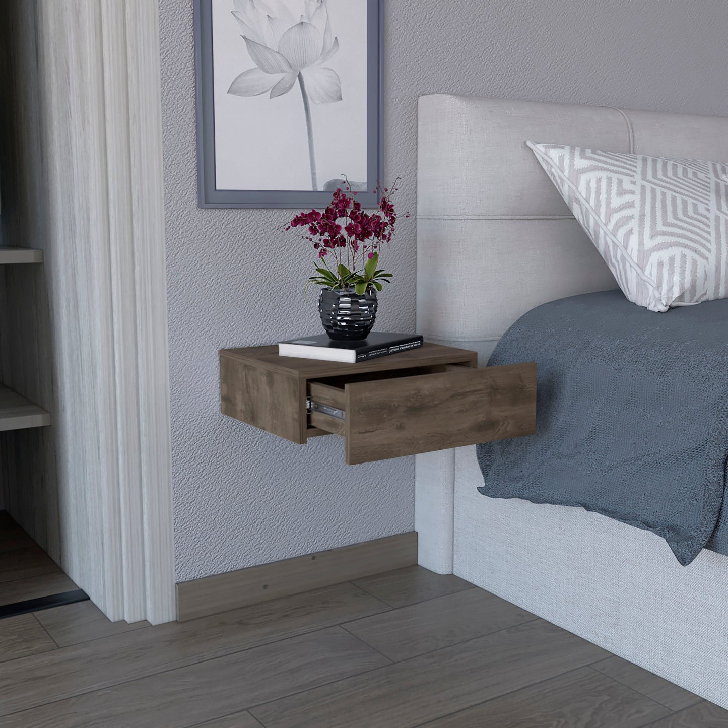 Walnut finish floating nightstand with open drawer holding a book and vase