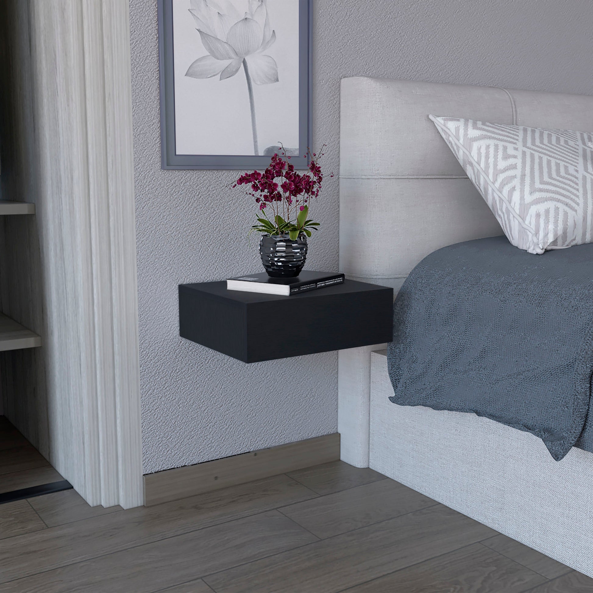 Sleek black floating nightstand with a modern design ideal for bedside storage