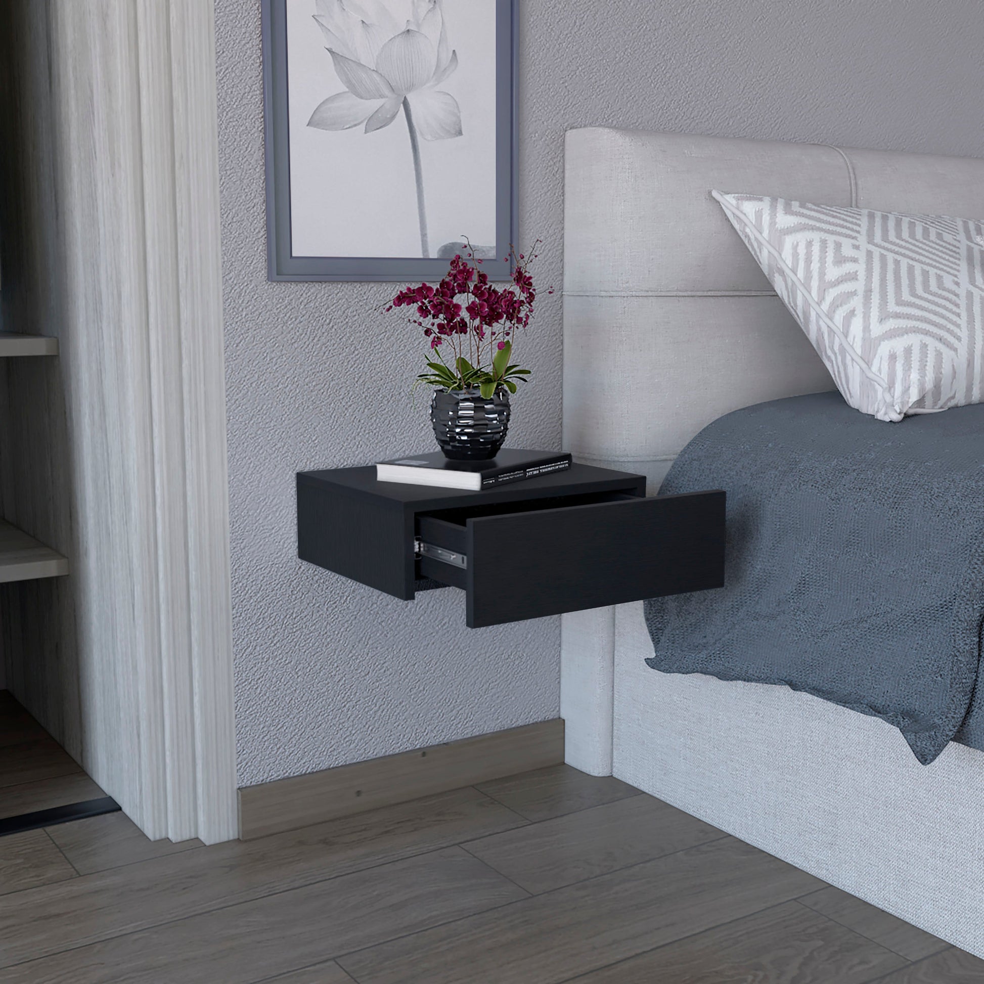 Modern black floating nightstand with one open drawer perfect for bedroom storage