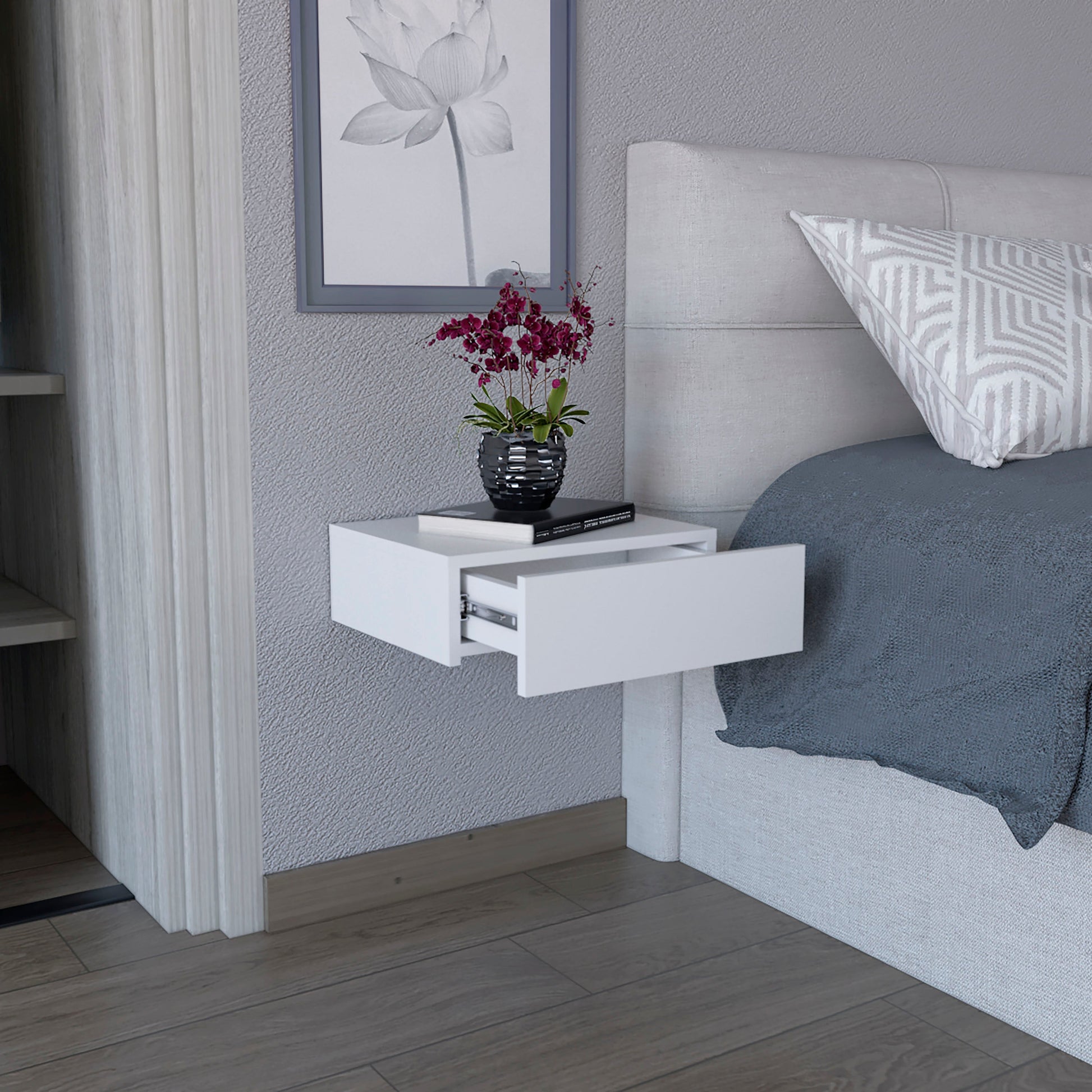 Modern white floating nightstand with one open drawer and silver hardware