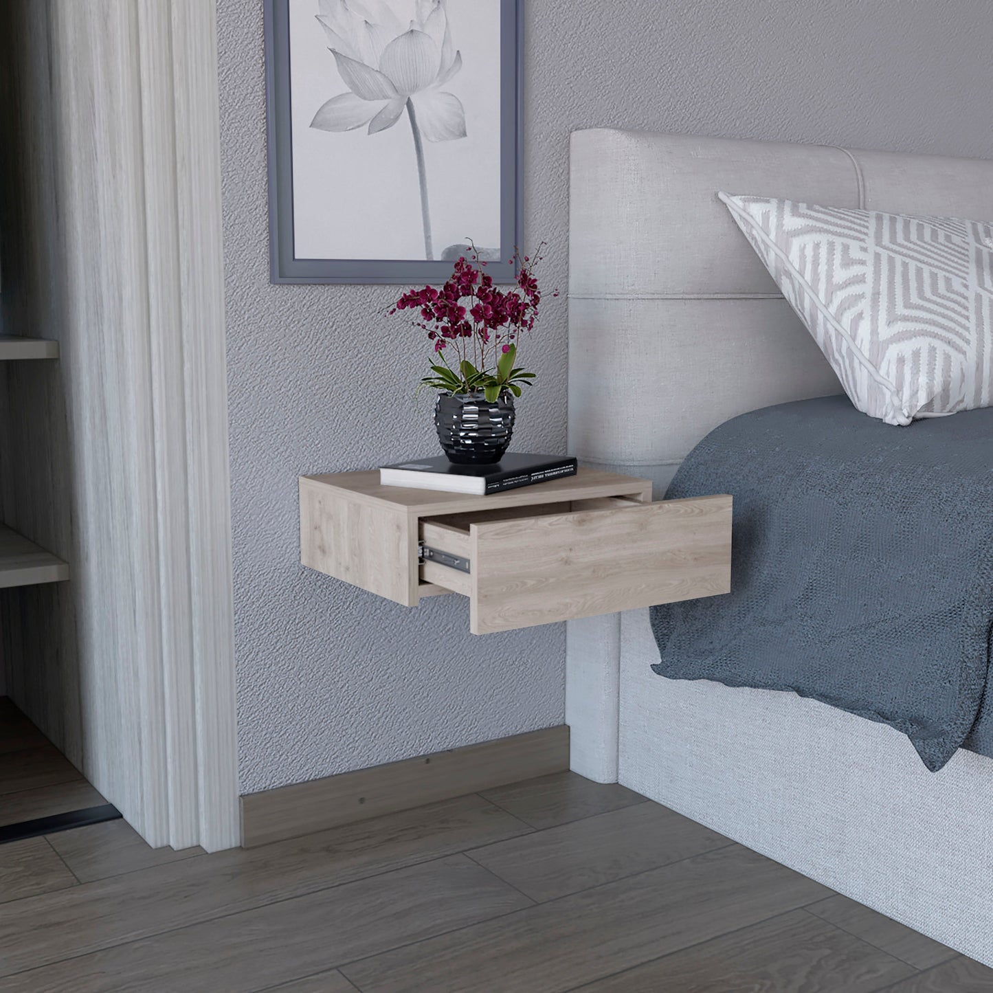 Light wood floating nightstand with an open drawer next to a bed