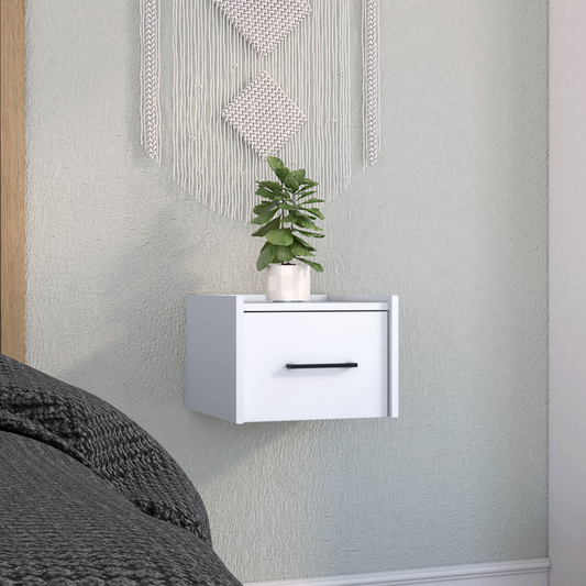 White modern floating nightstand with black handle and potted plant