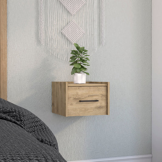 Floating wooden nightstand with black handle next to bed