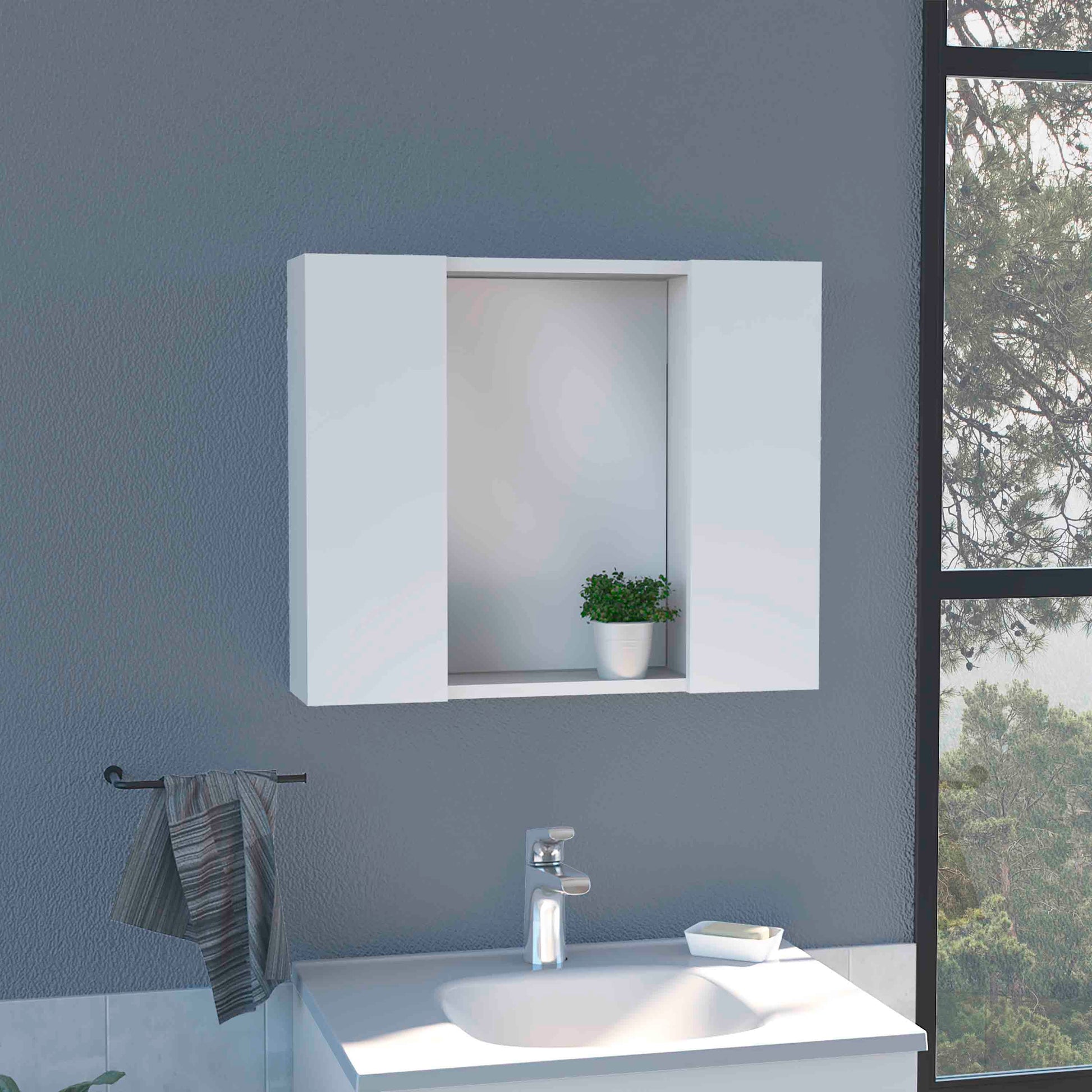 Modern white medicine cabinet with mirrored doors mounted above a sink and faucet