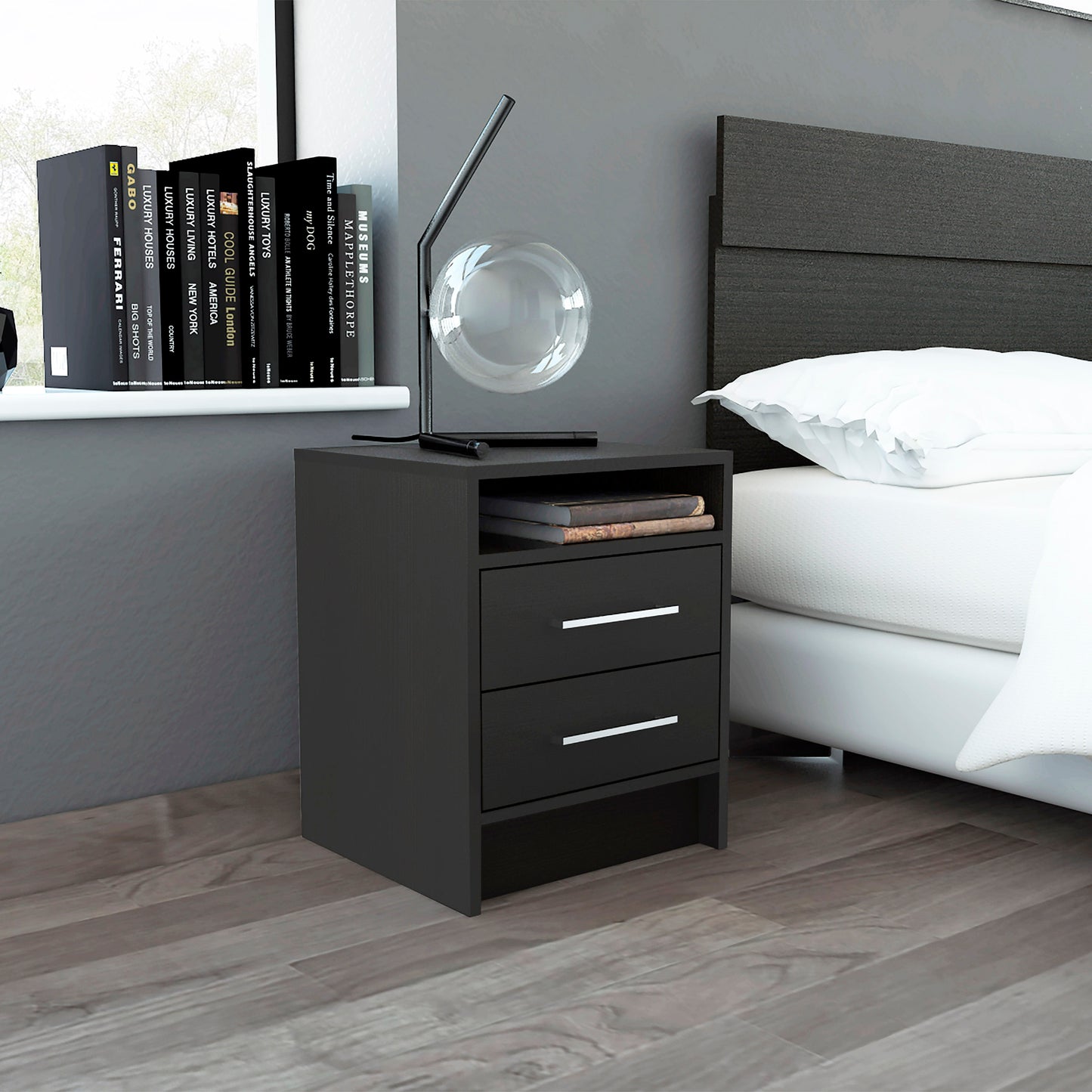 Black modern nightstand with two drawers and a shelf next to a bed