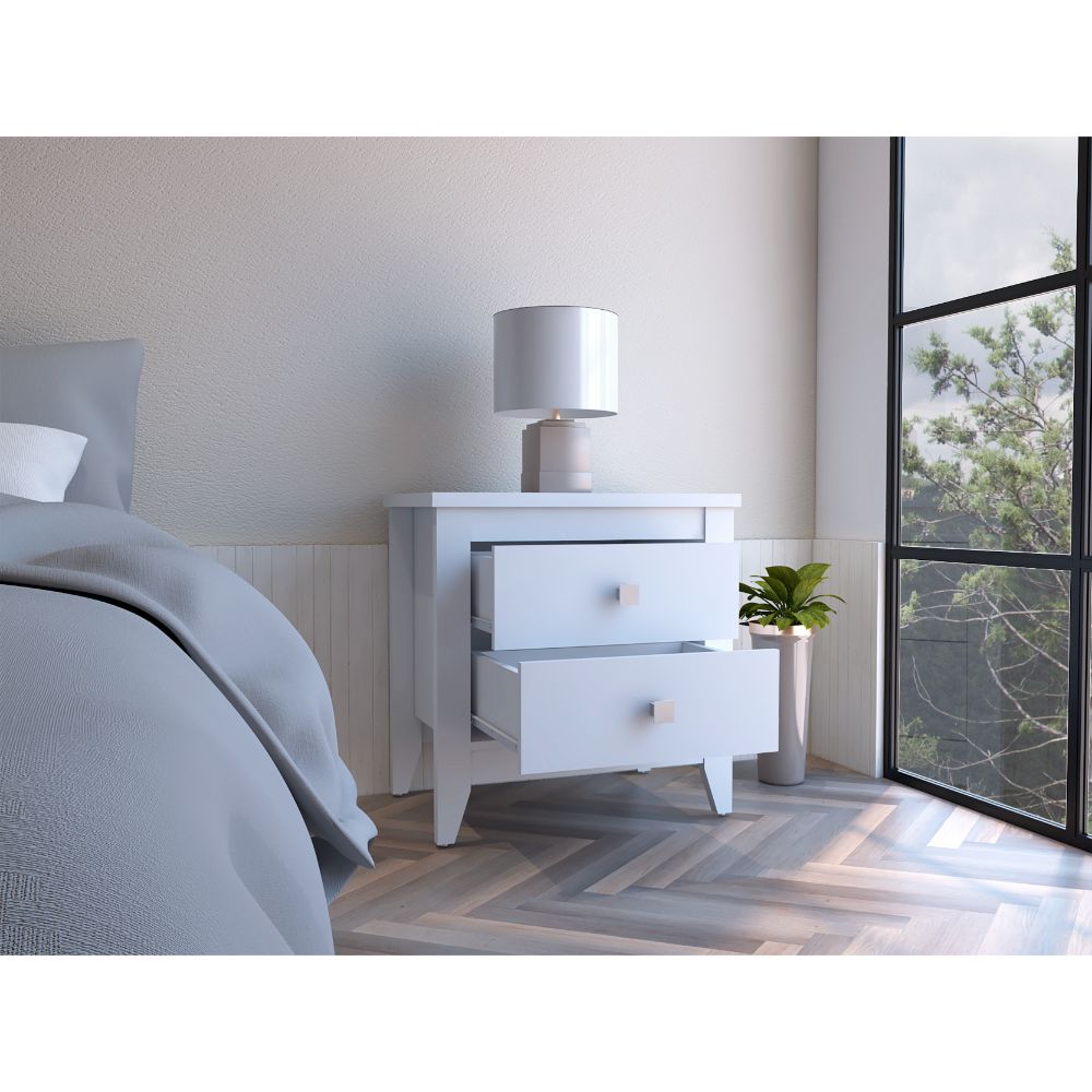 White twodrawer nightstand with modern silver knobs beside a bed