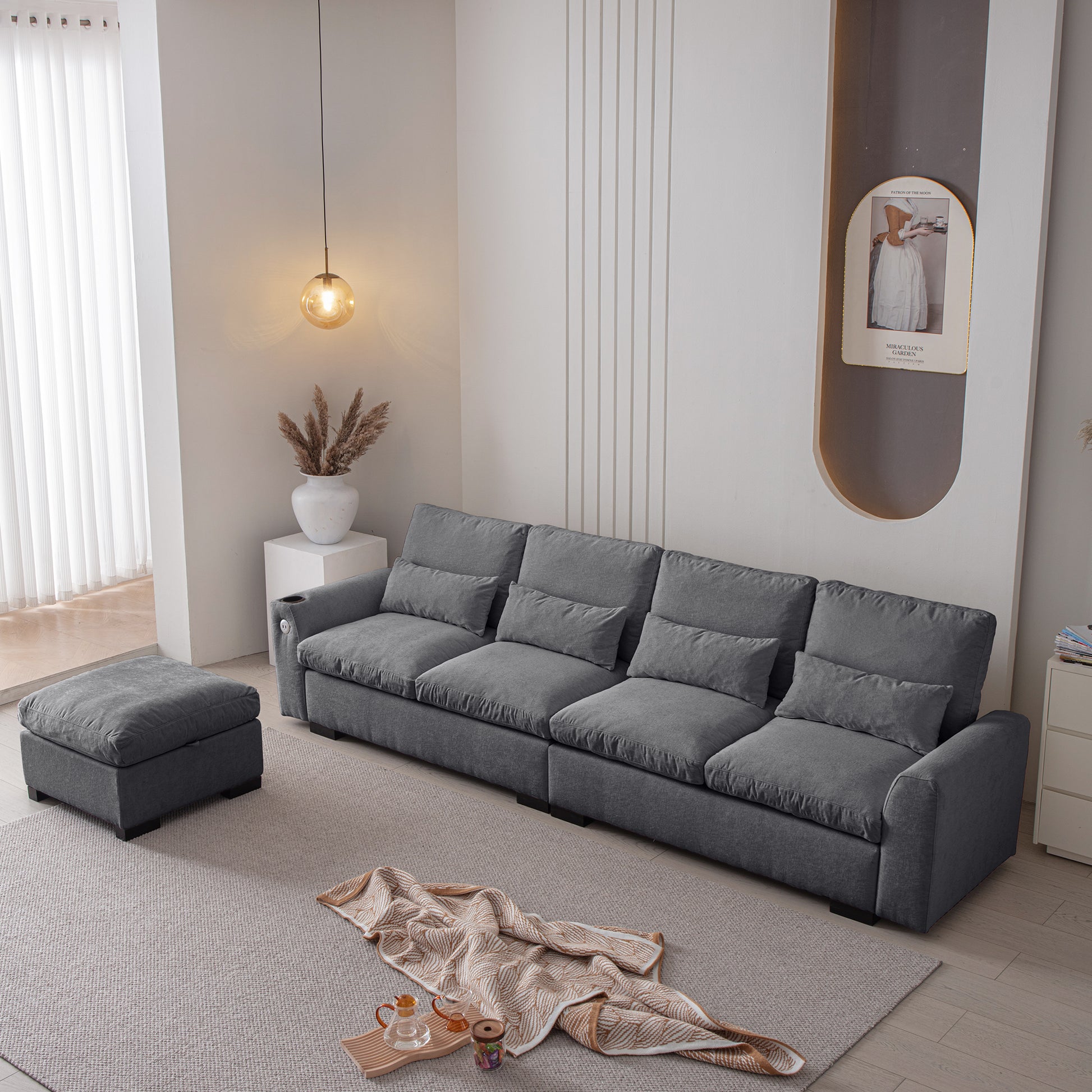Spacious grey fabric sectional sofa with matching ottoman for modern living rooms