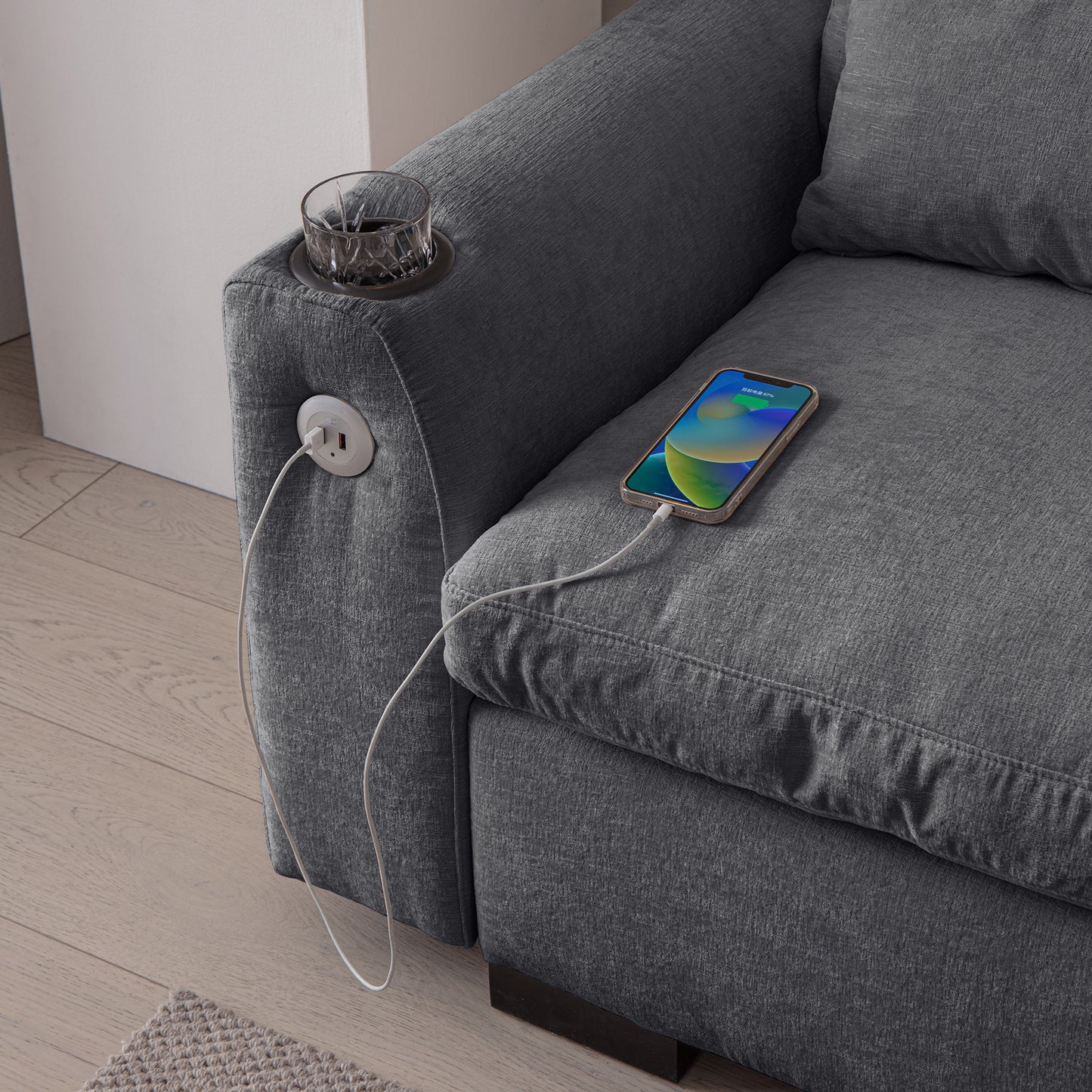 Grey fabric sectional sofa with integrated power outlet and phone charging