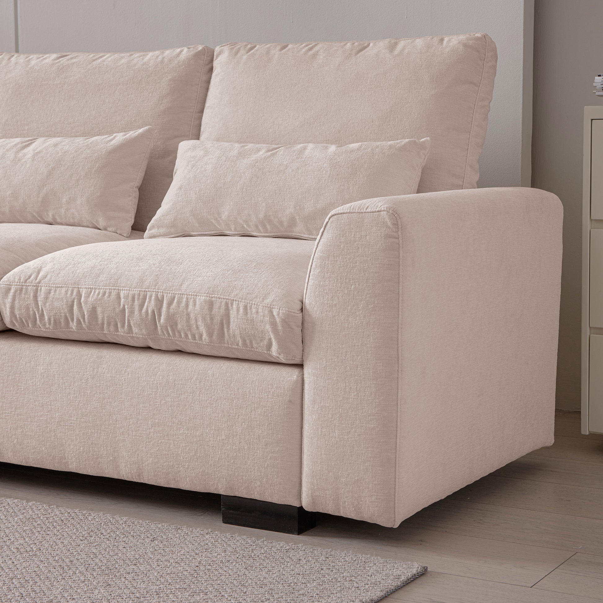 Plush beige fabric sofa with lumbar and square throw pillows modern living room furniture