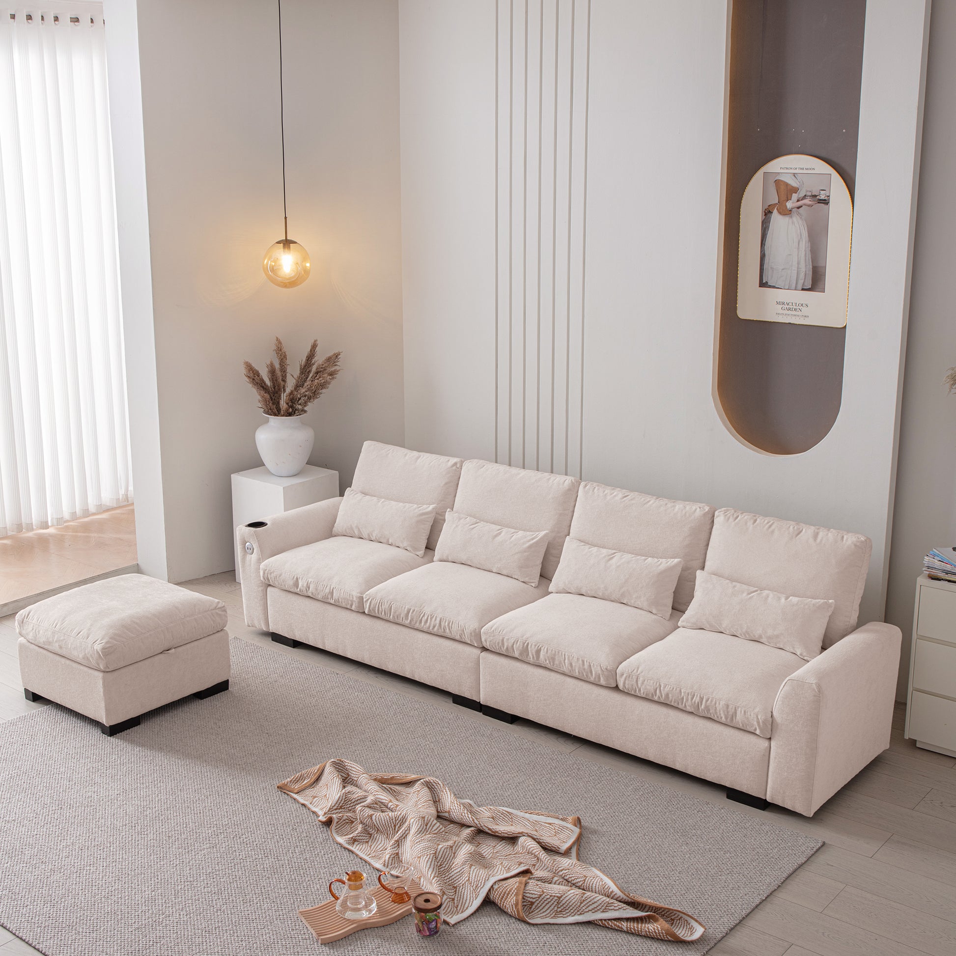 Modern modular beige sofa with plush cushions and matching ottoman