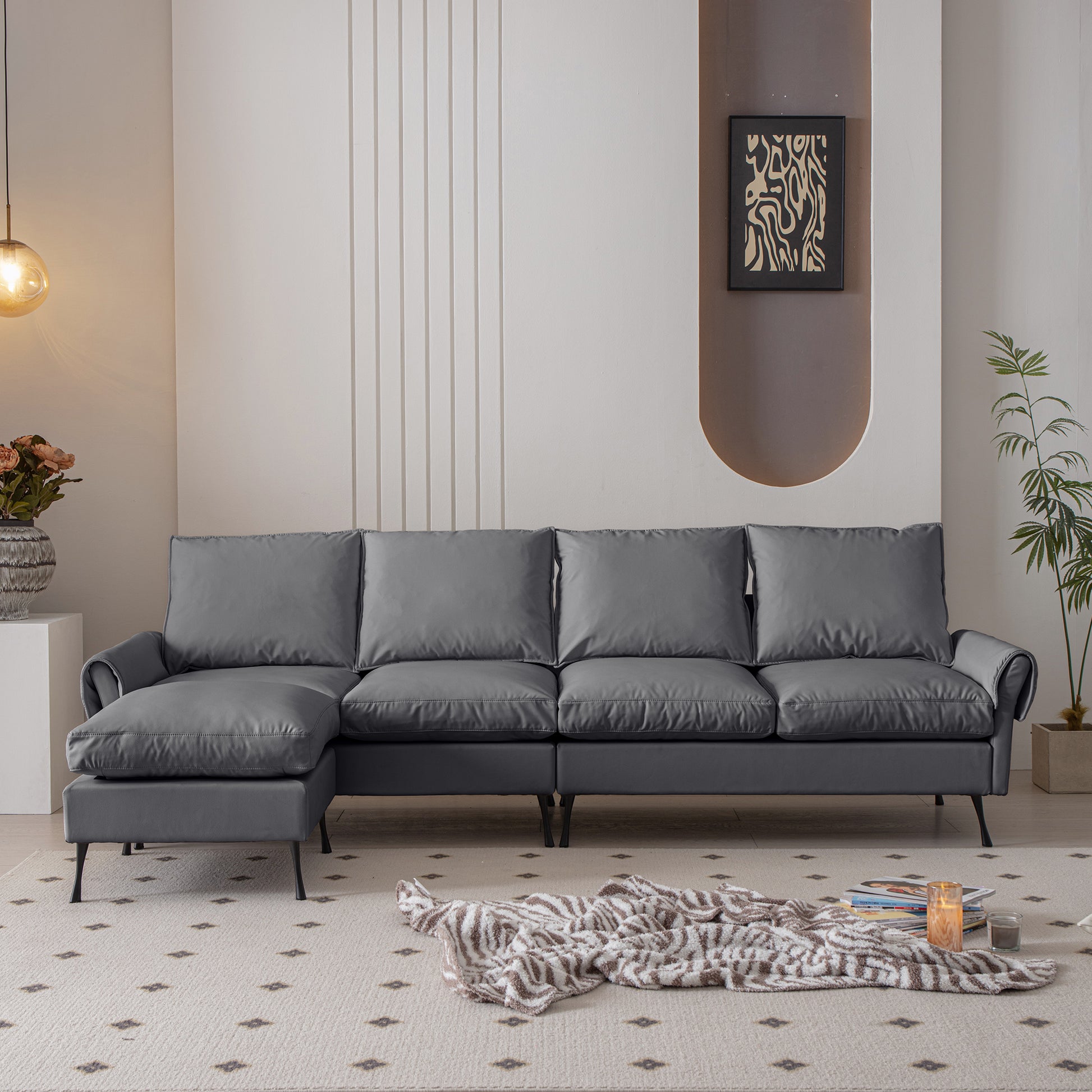 Deep charcoal grey sectional sofa with plush cushions and modern black legs perfect for living rooms