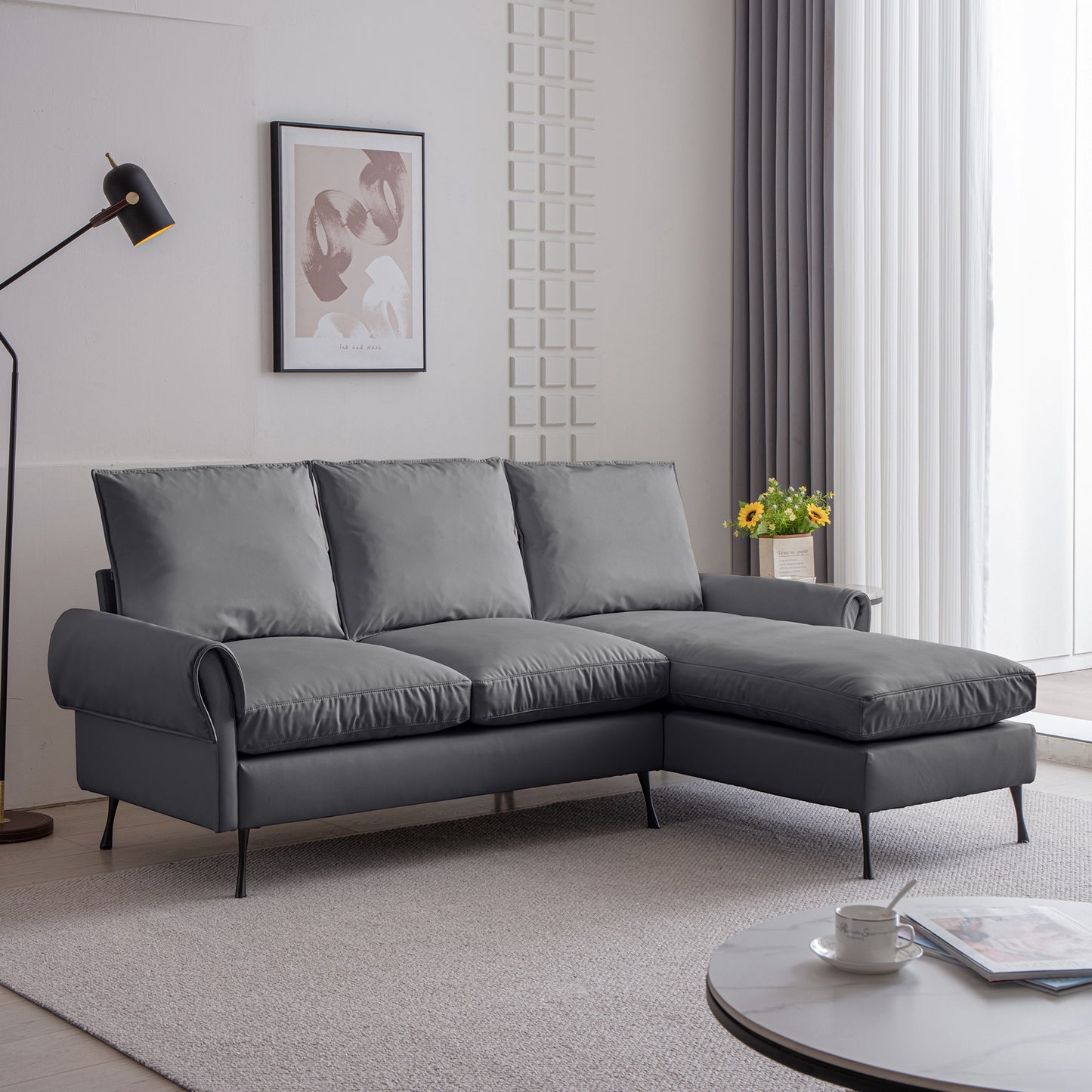 Dark gray sectional sofa with plush cushions and sleek metal legs ideal for modern living rooms