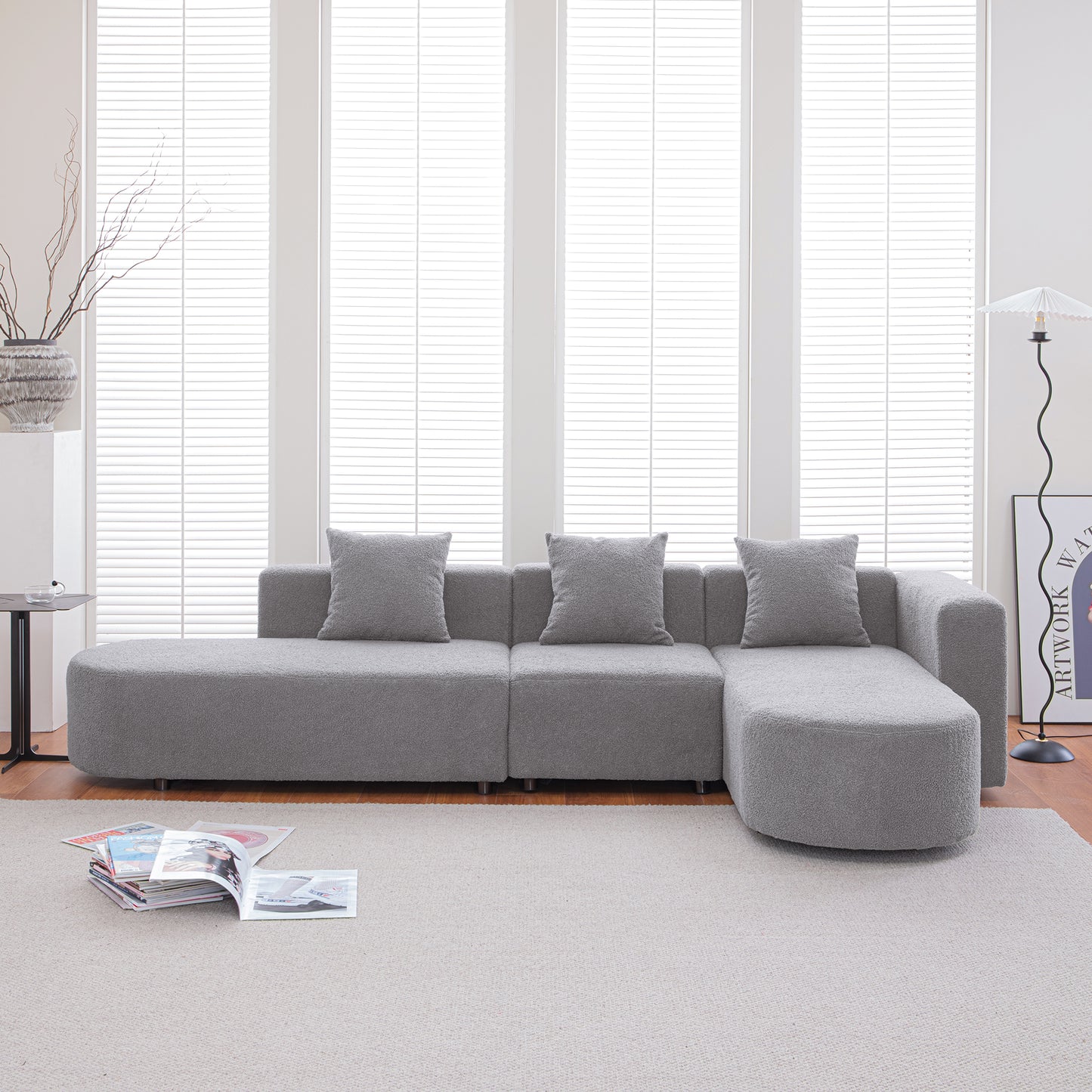 Plush gray sectional sofa with modern design and throw pillows