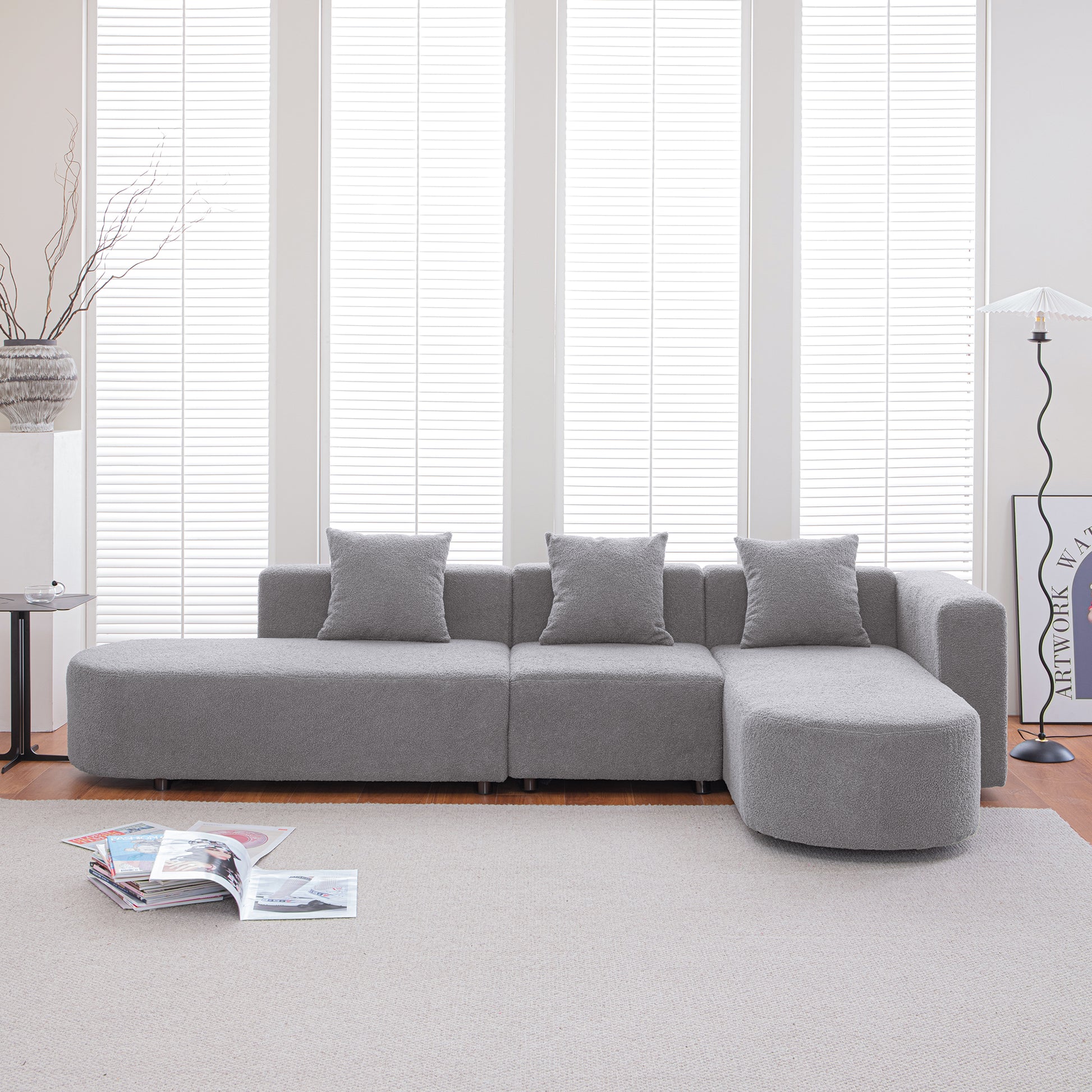 Plush gray sectional sofa with modern design and throw pillows