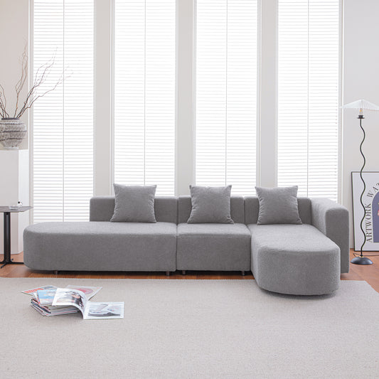 Plush gray sectional sofa with modern design and throw pillows