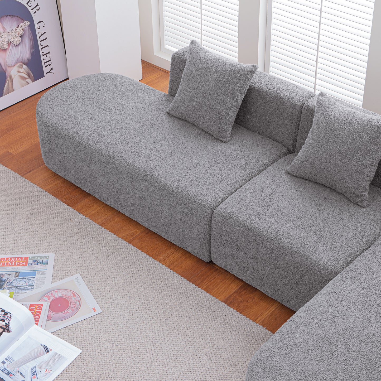 Comfortable grey teddy fabric sectional sofa with plush cushions