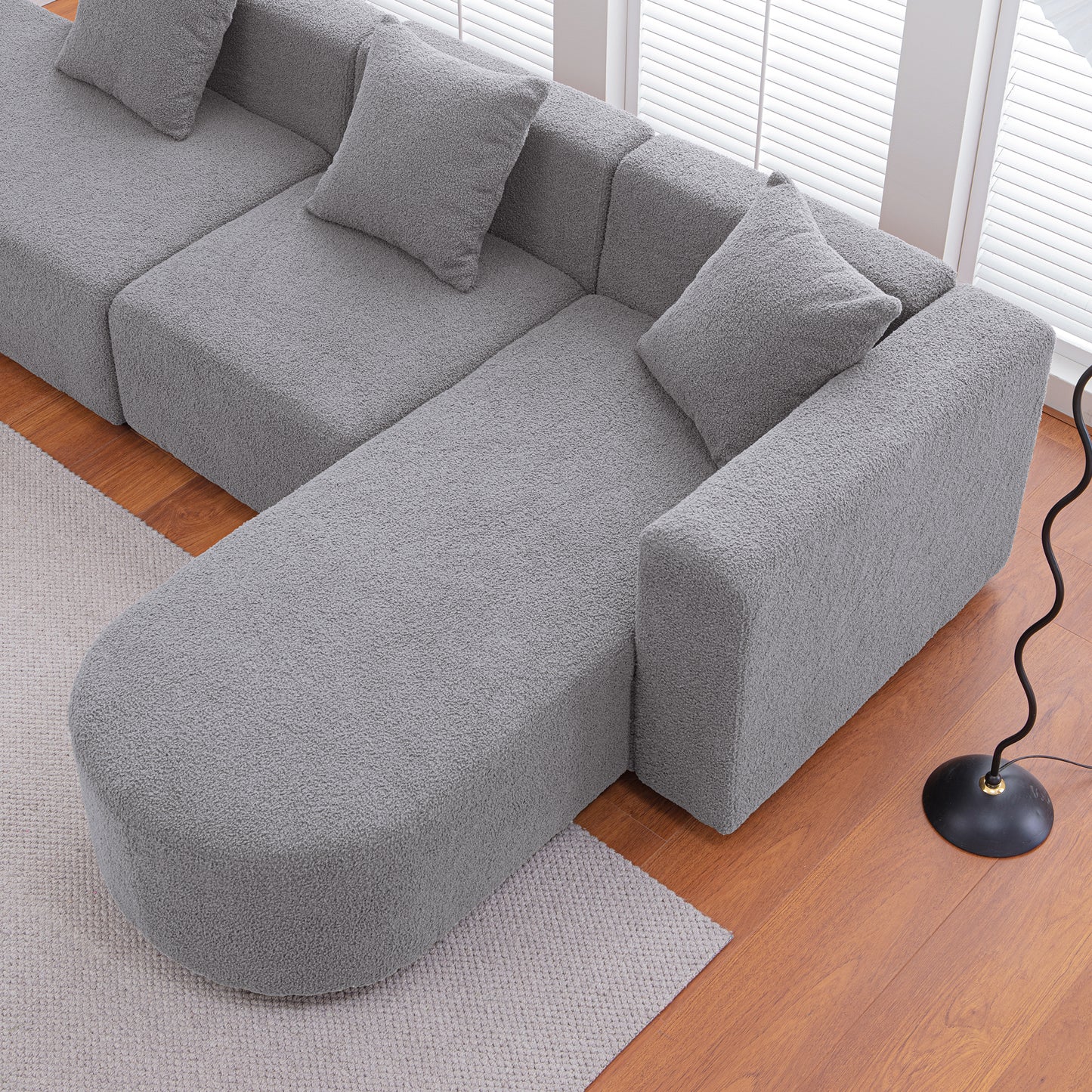 Cozy grey boucl sectional sofa with chaise perfect for modern living rooms