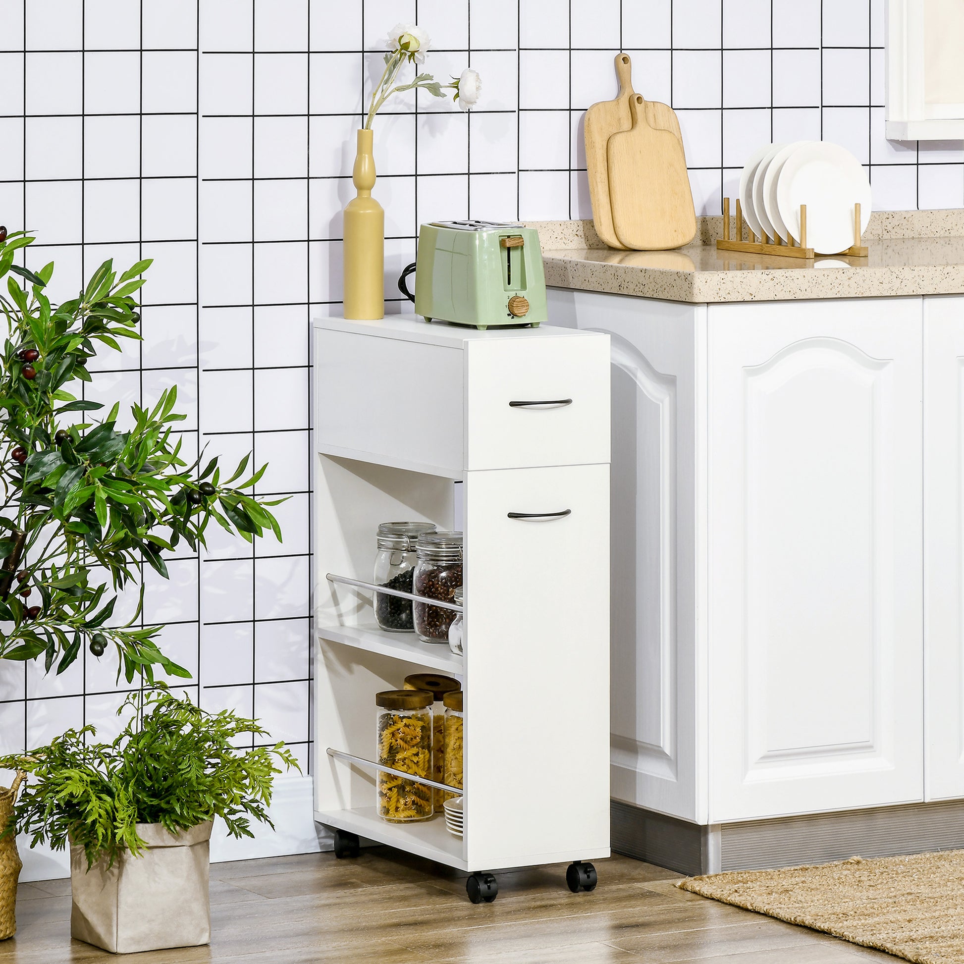 White slim kitchen cart with two drawers and open shelves storing pasta and jars