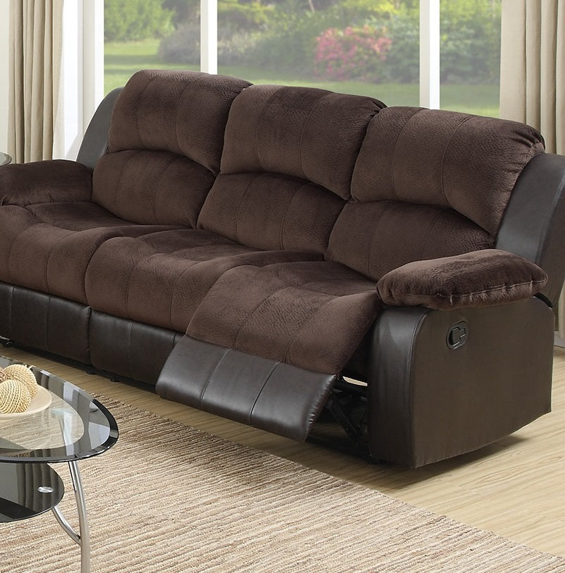 Brown microfiber and faux leather reclining sofa with plush cushions and accessible levers