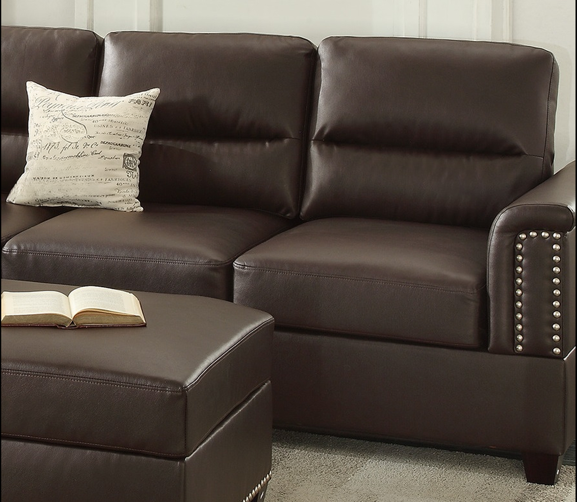 Spacious dark brown faux leather sectional sofa with tufted back cushions and studded armrest