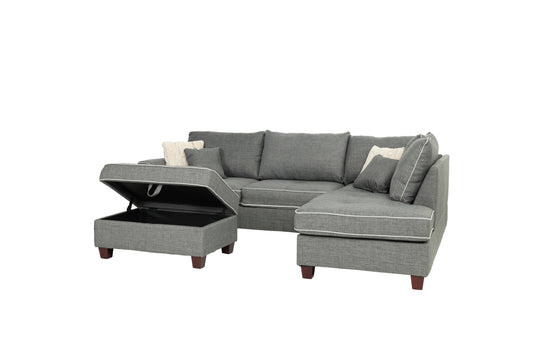 Gray sectional sofa with storage ottoman featuring white piping and plush cushions