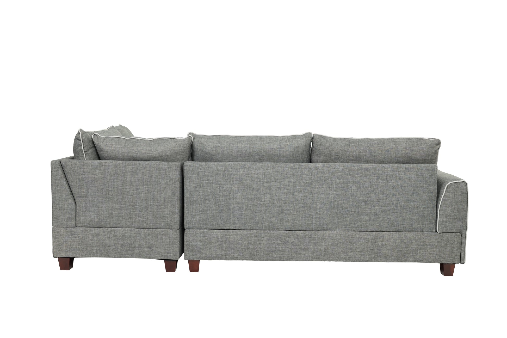 Grey upholstered sectional sofa with white piping on cushions