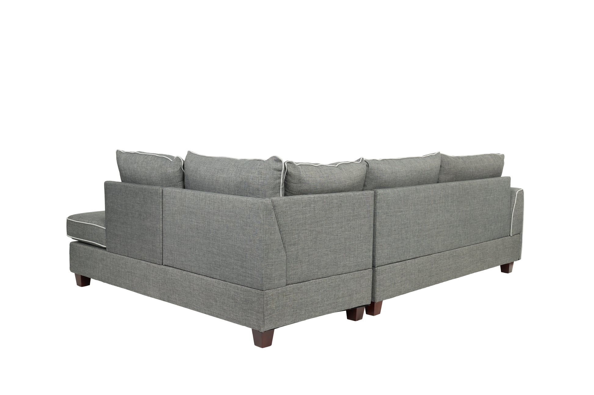Gray upholstered sectional sofa with white piping a chaise and wooden legs