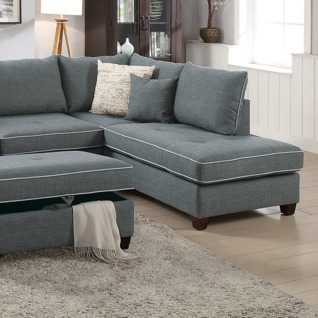 Contemporary grey sectional sofa with chaise lounge and storage ottoman